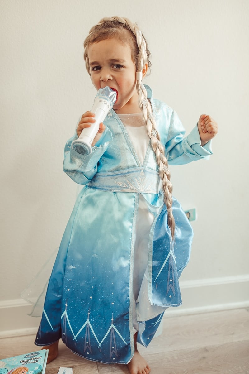 toddler singing in frozen dress