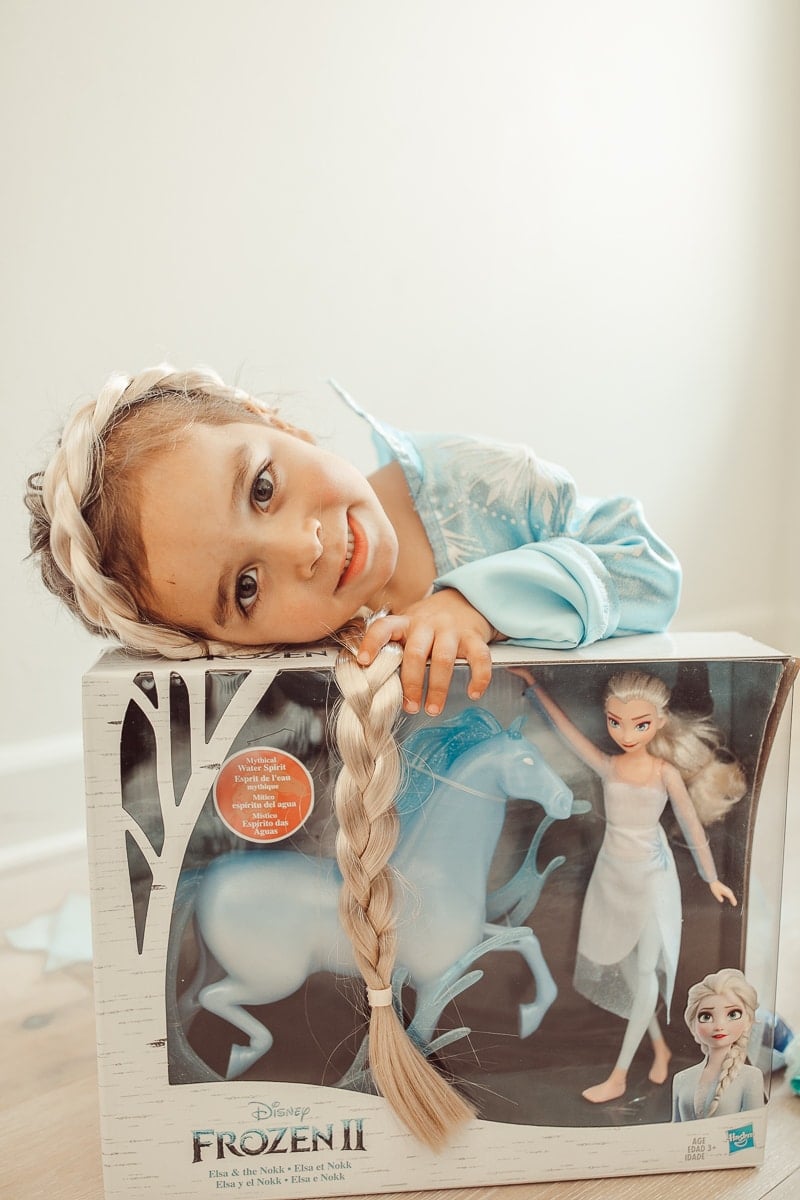 child with disney frozen 2 toy