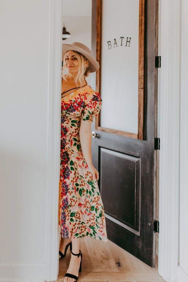 woman smiling from doorway