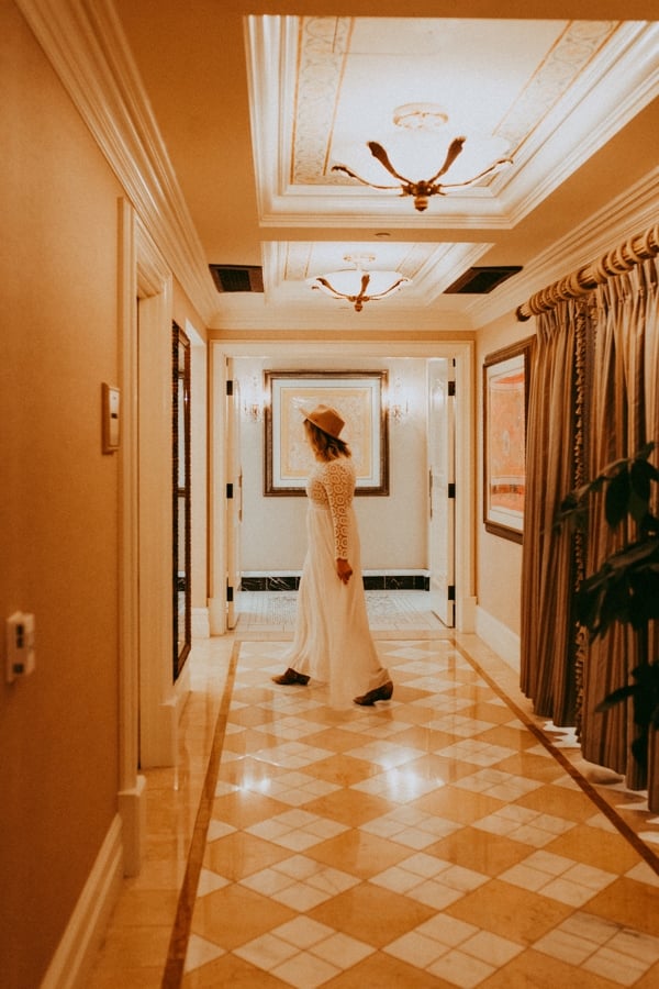 woman walking down hallway