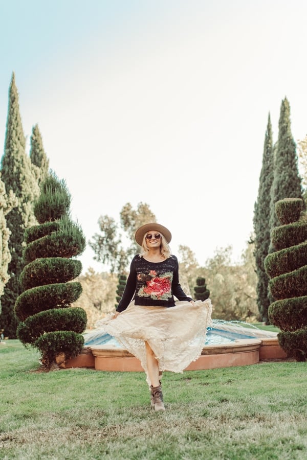 woman walking by fountain