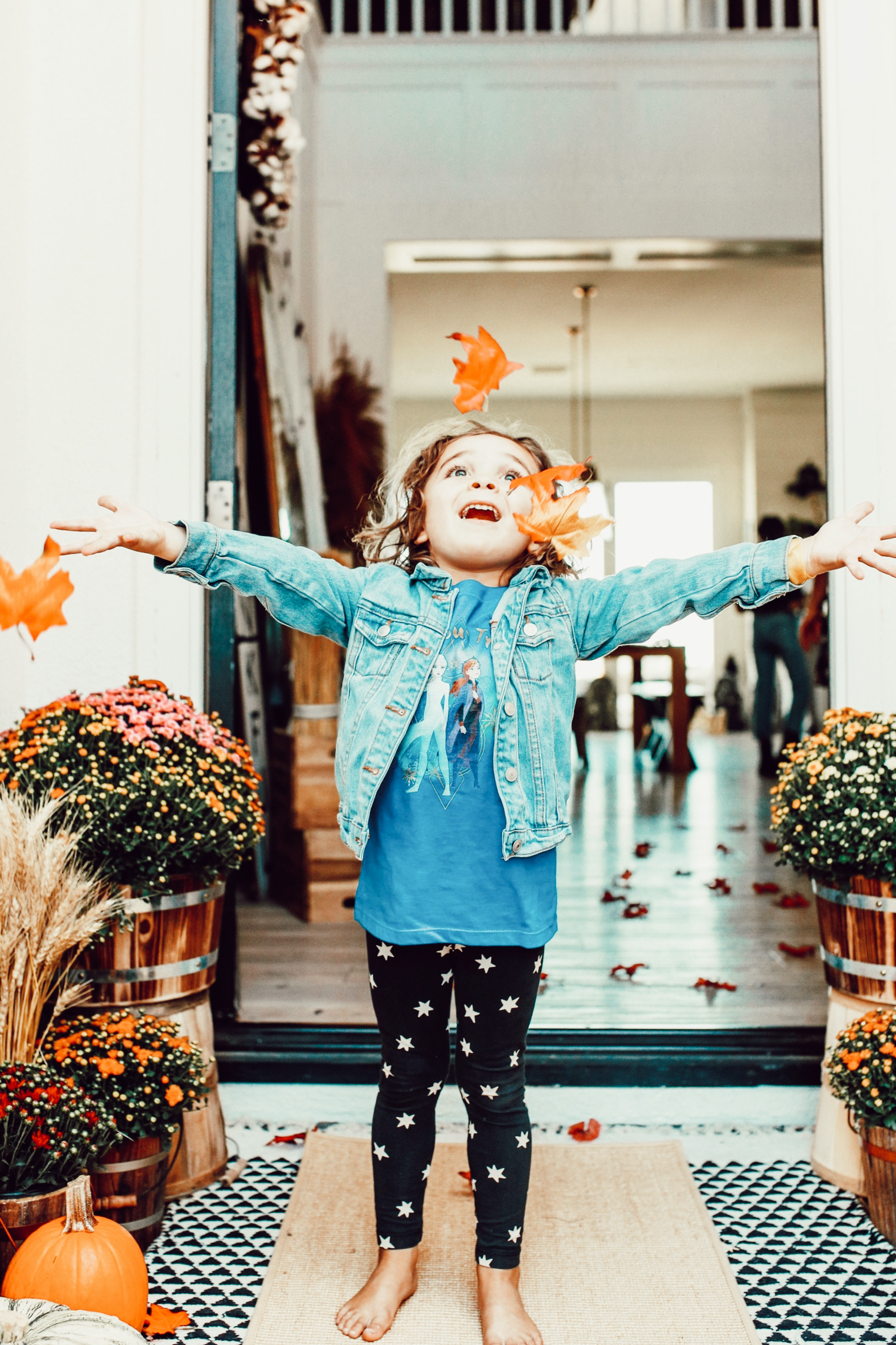 boy playing with leaves