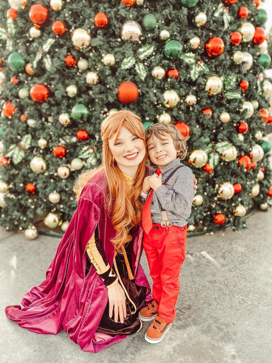 woman and boy by christmas tree