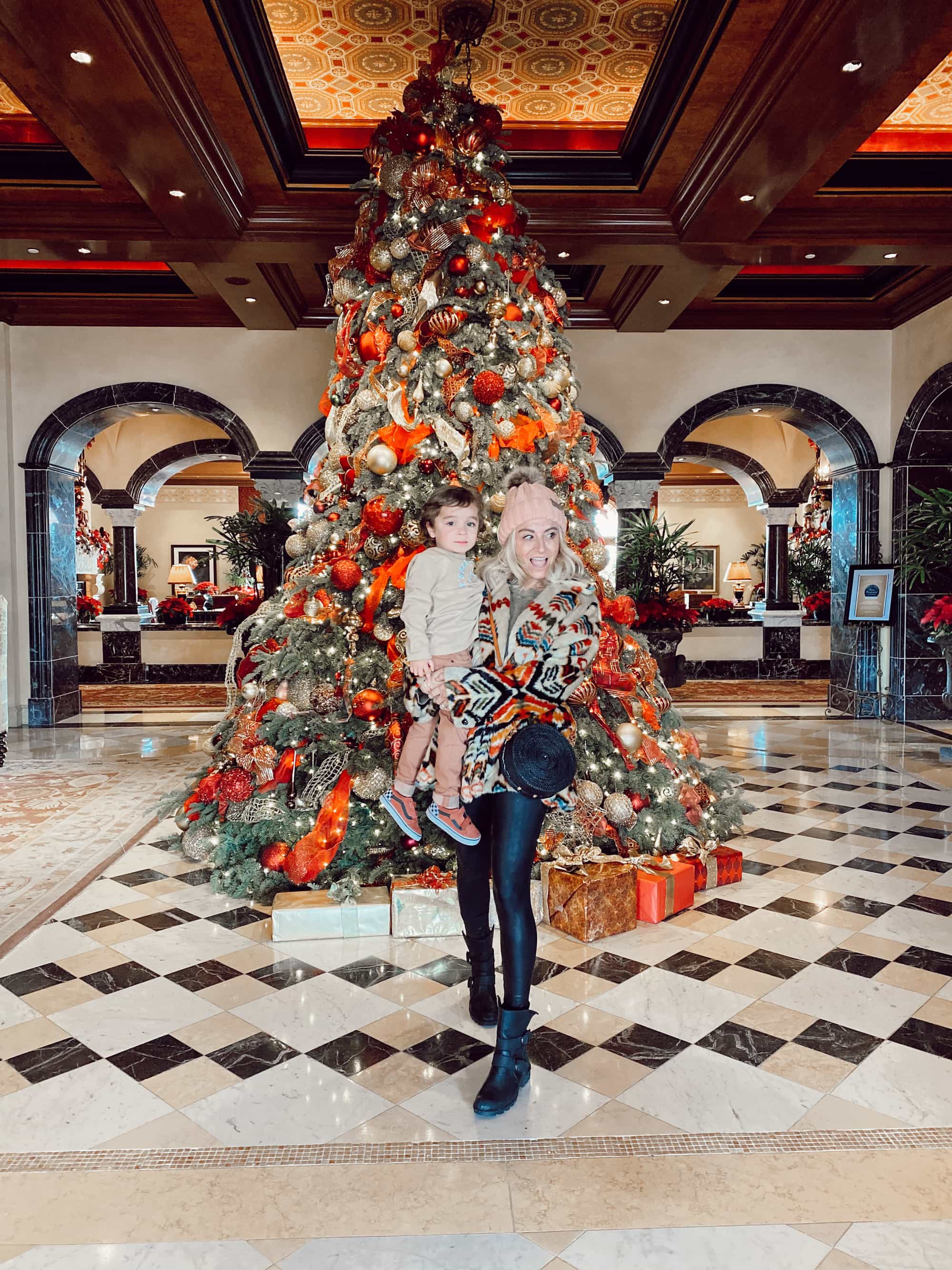 mom and baby by christmas tree