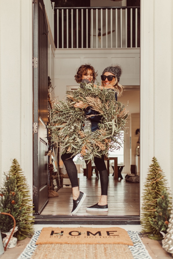 mom and baby with christmas wreath