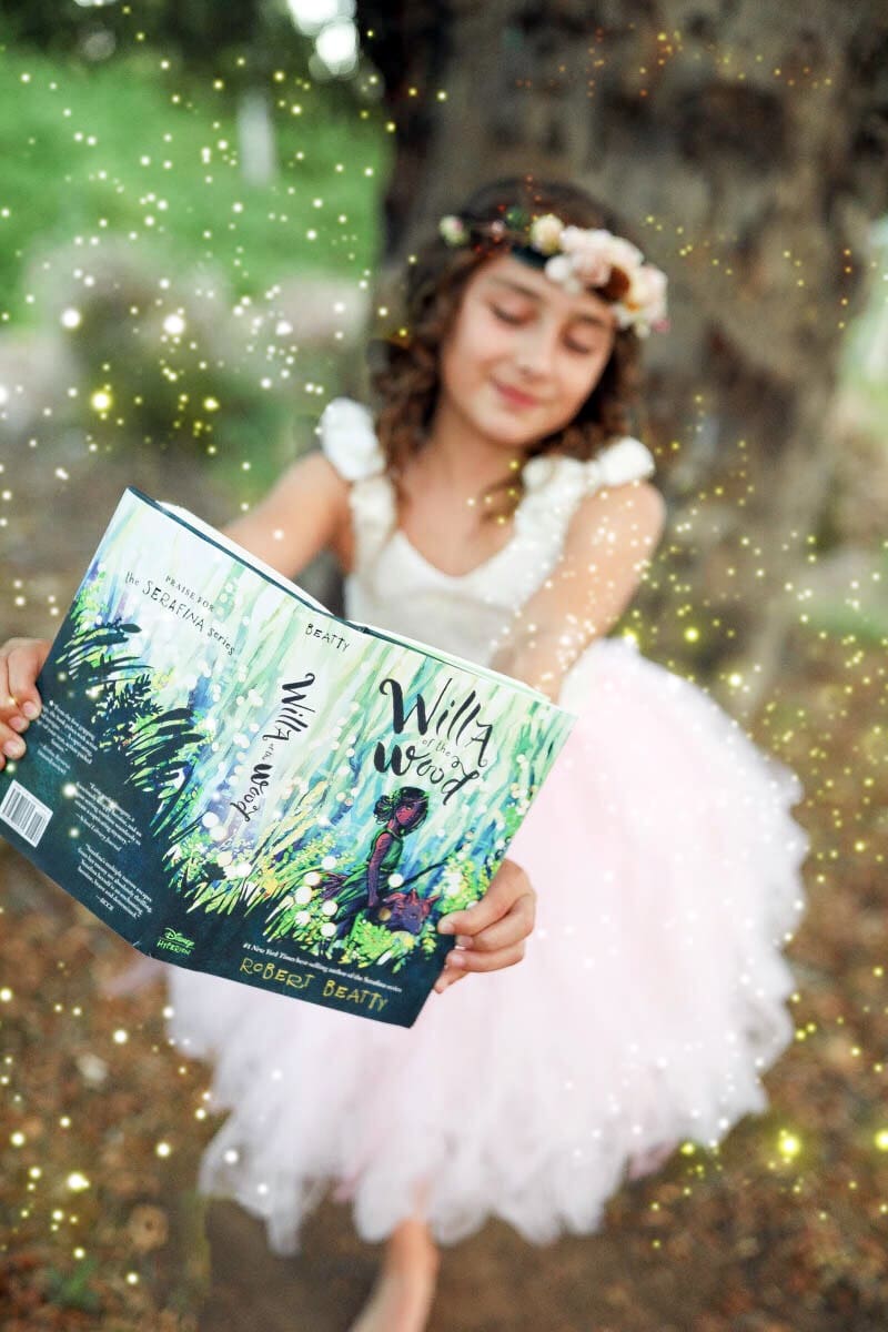 fairy girl holding a book