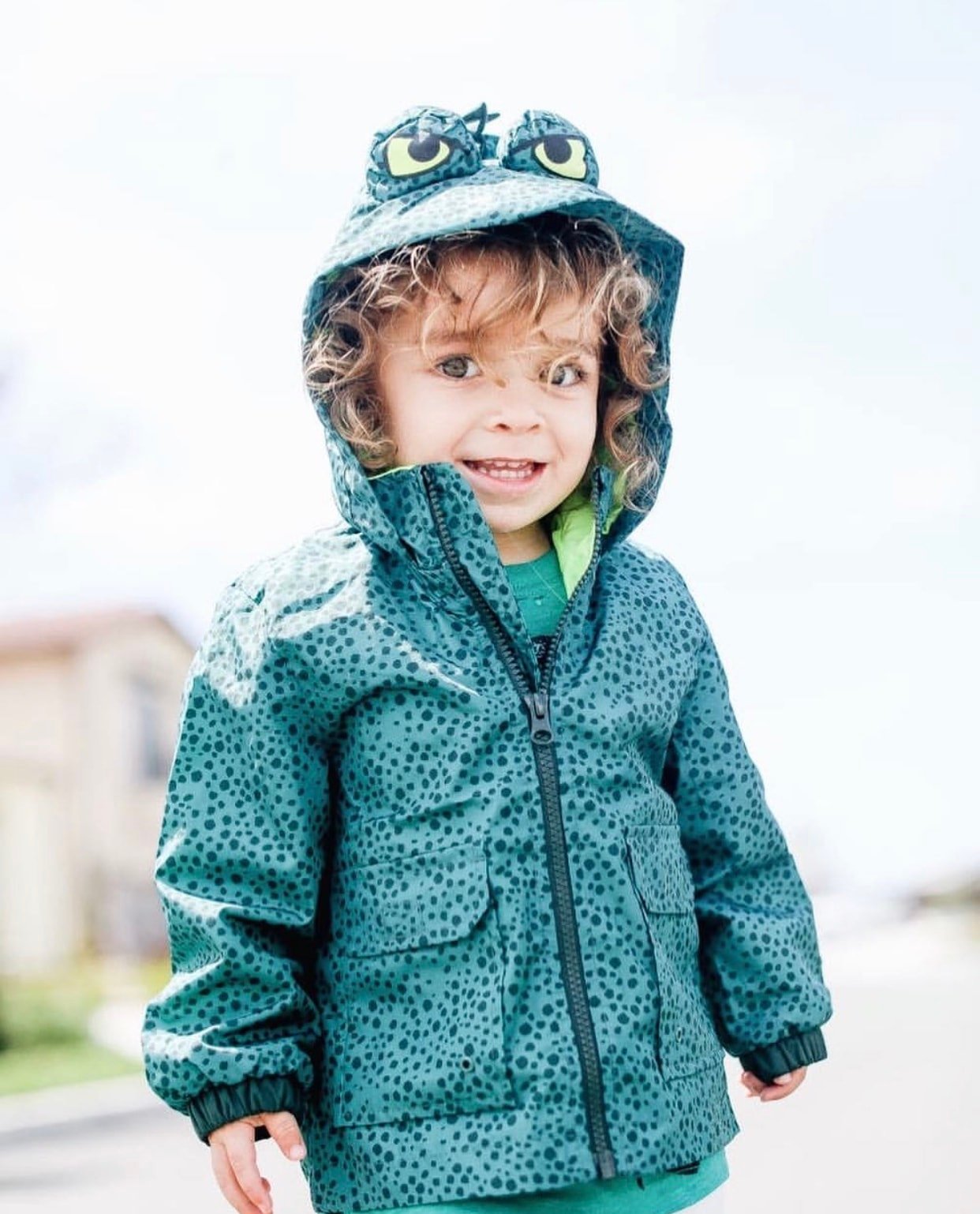 boy in dinosaur jacket