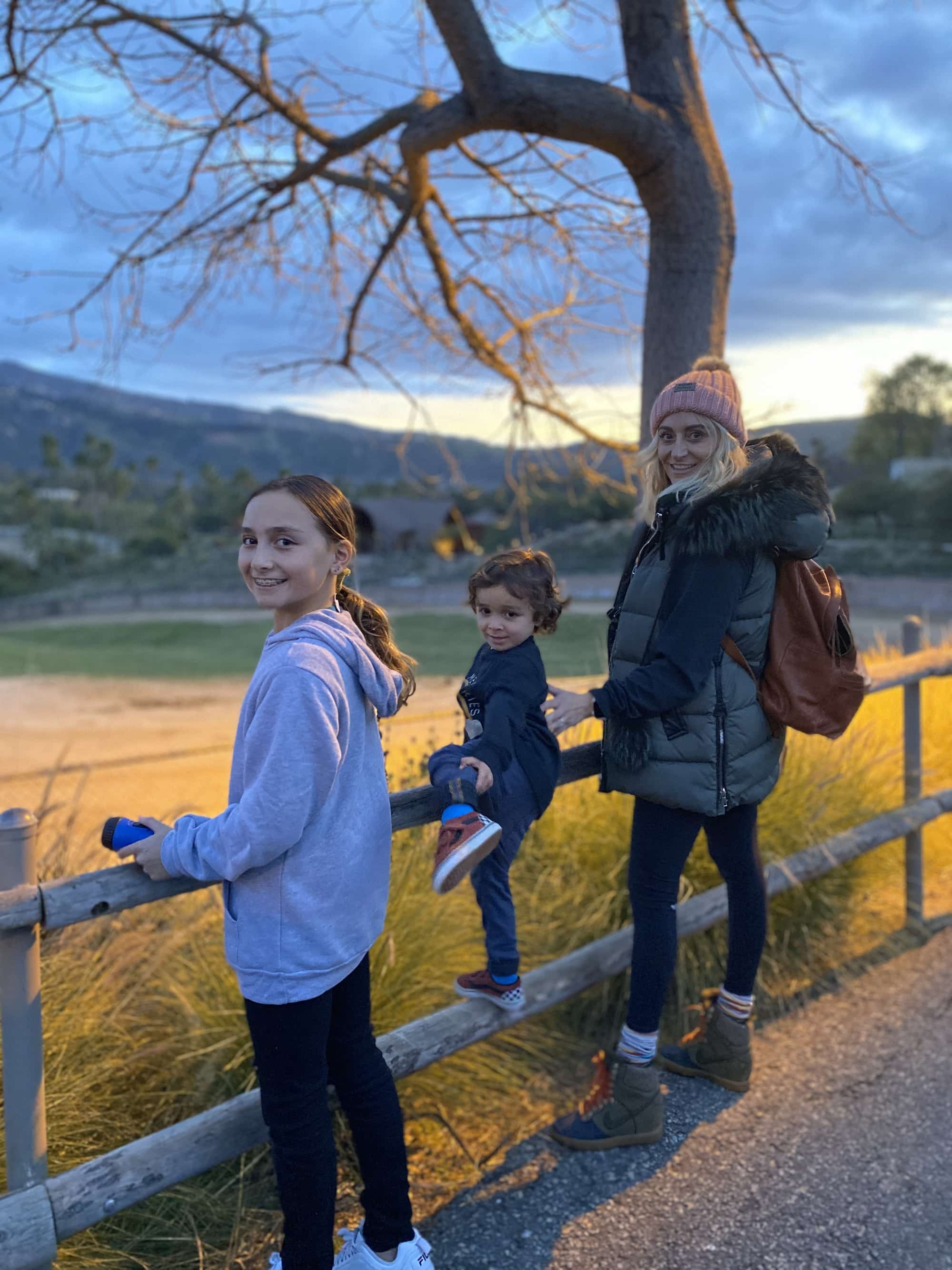 family watching animals at zoo