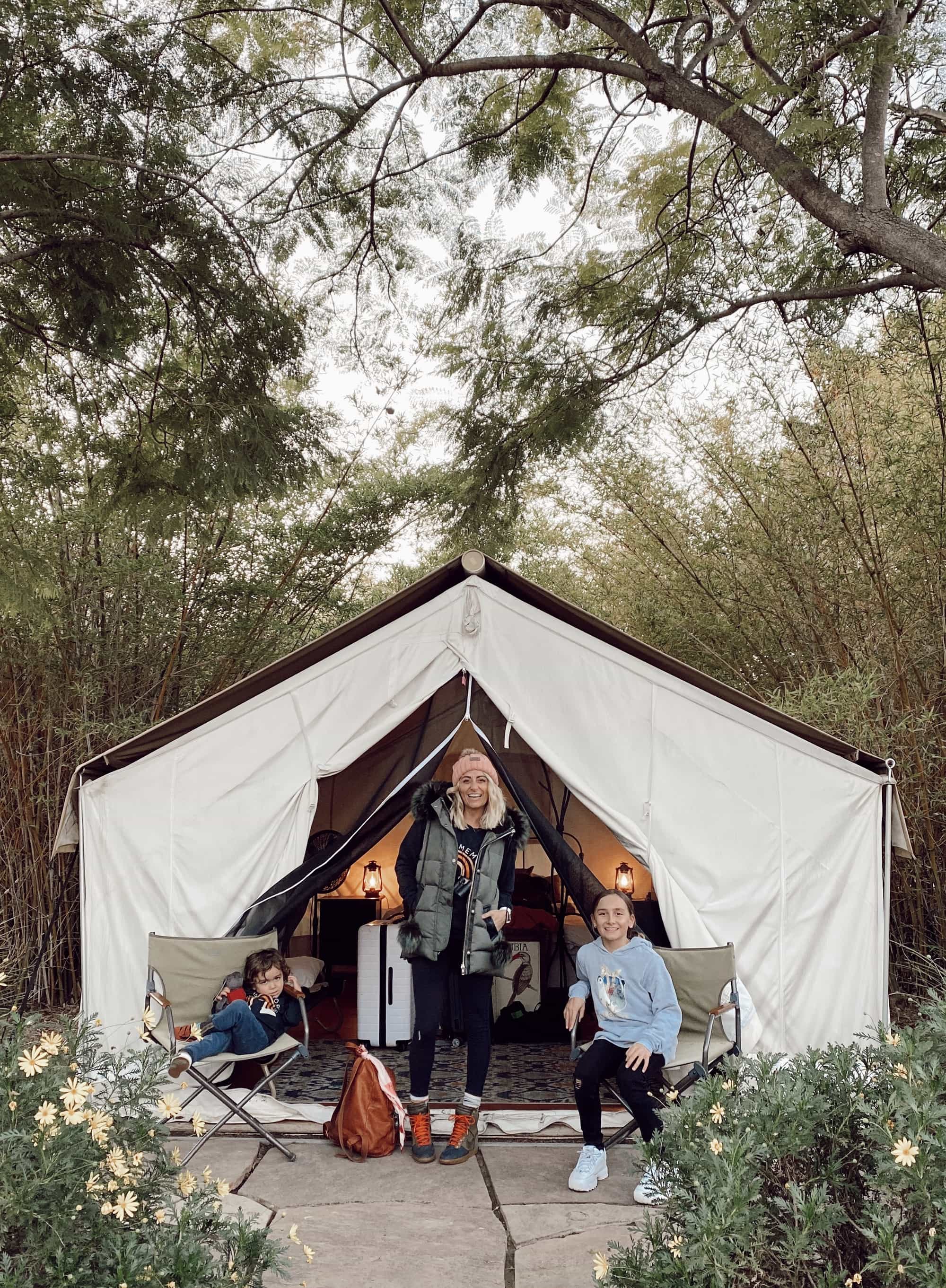 family in front of tent