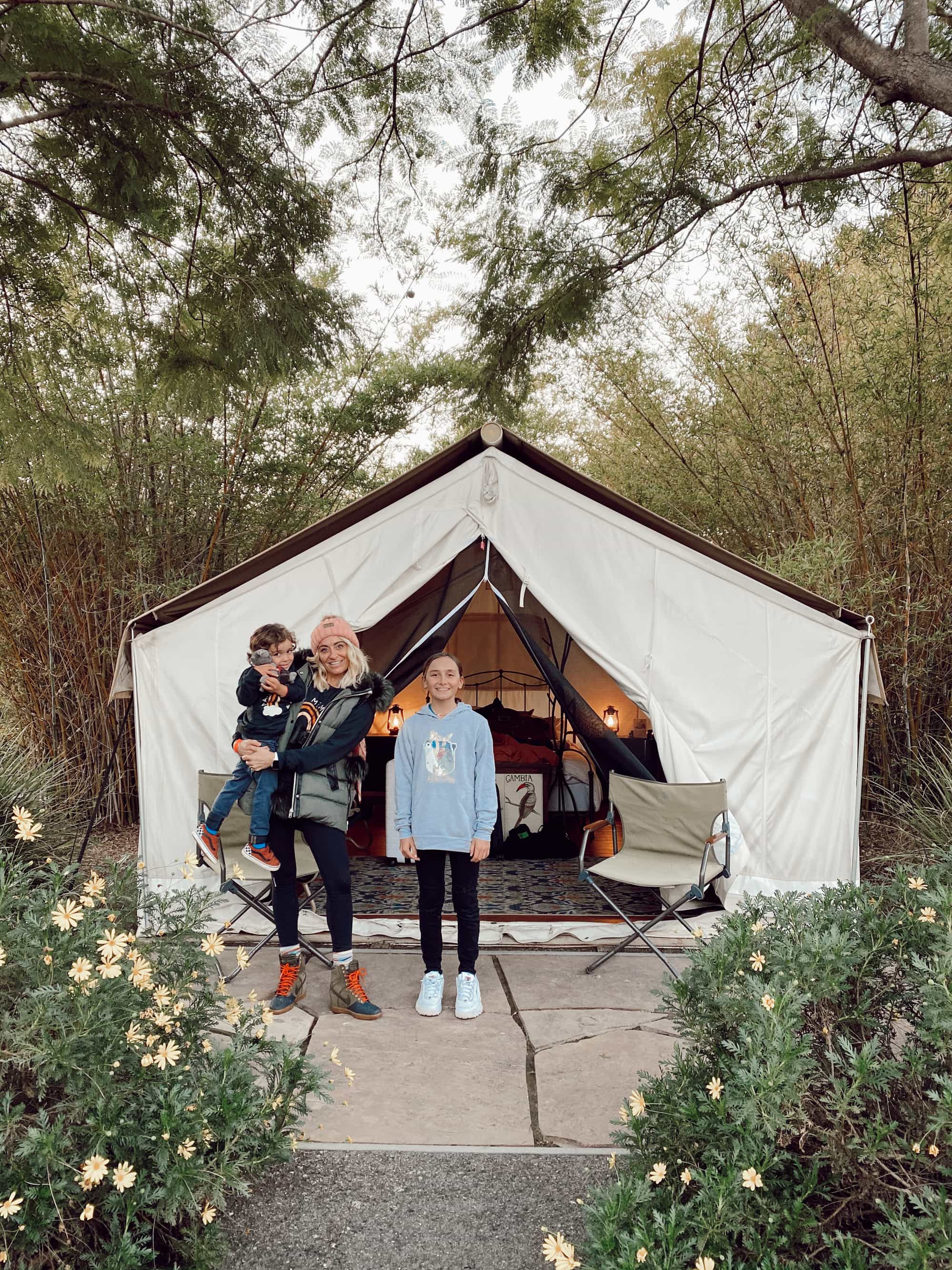 family in front of tent