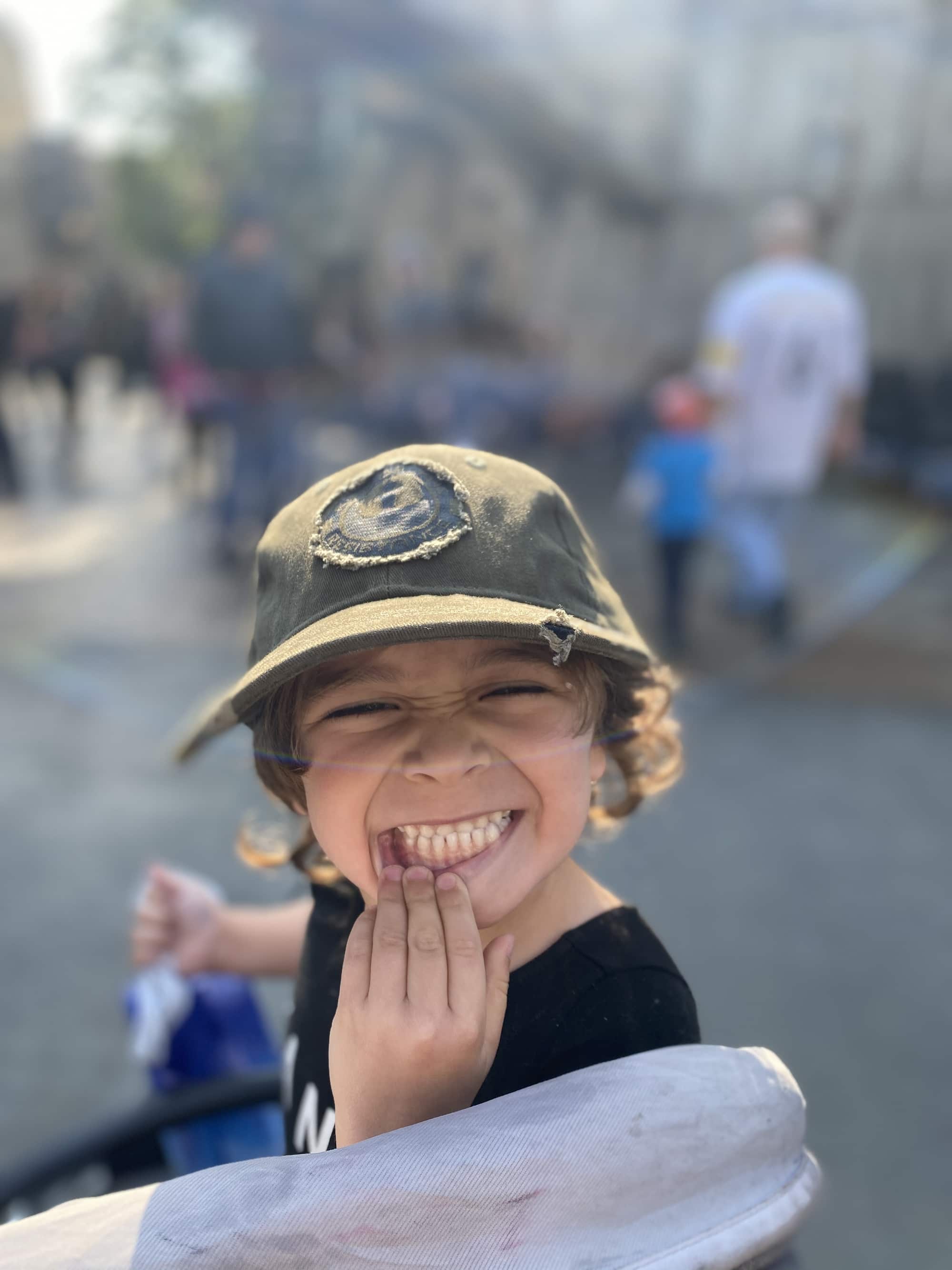 happy toddler in hat