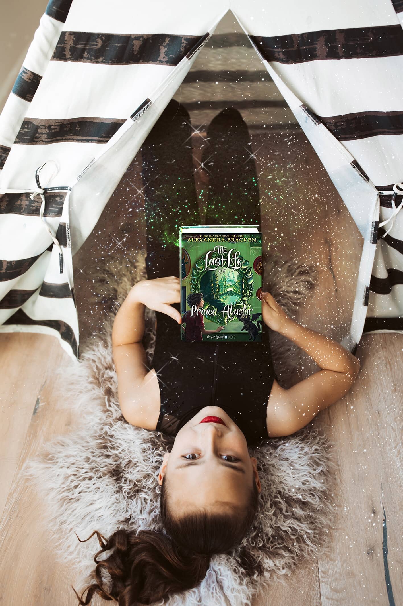 girl reading book in tent