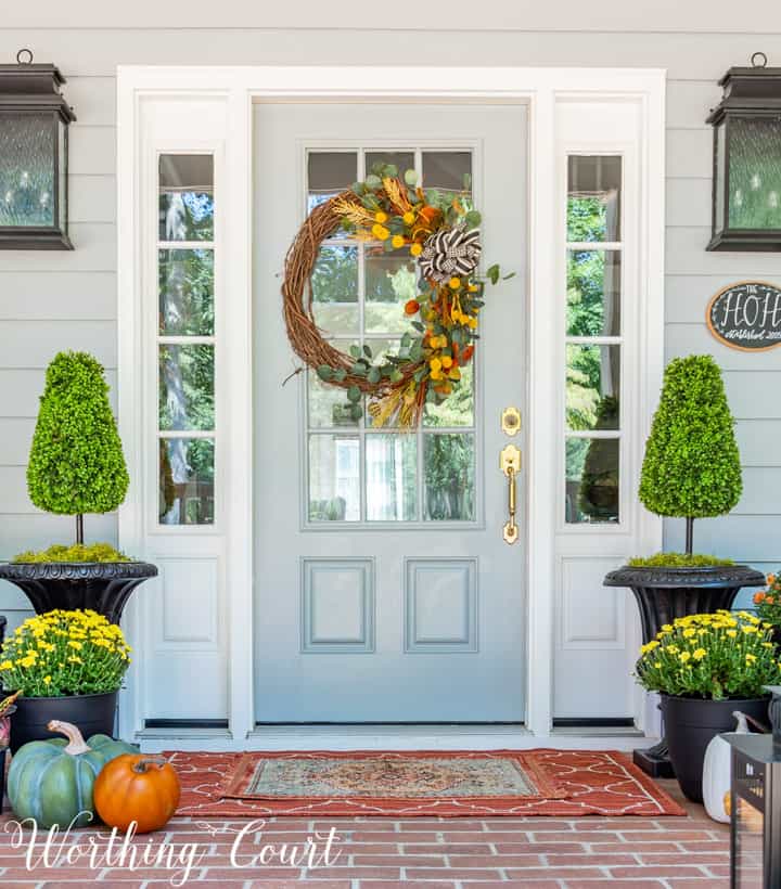 blue front door with wreath