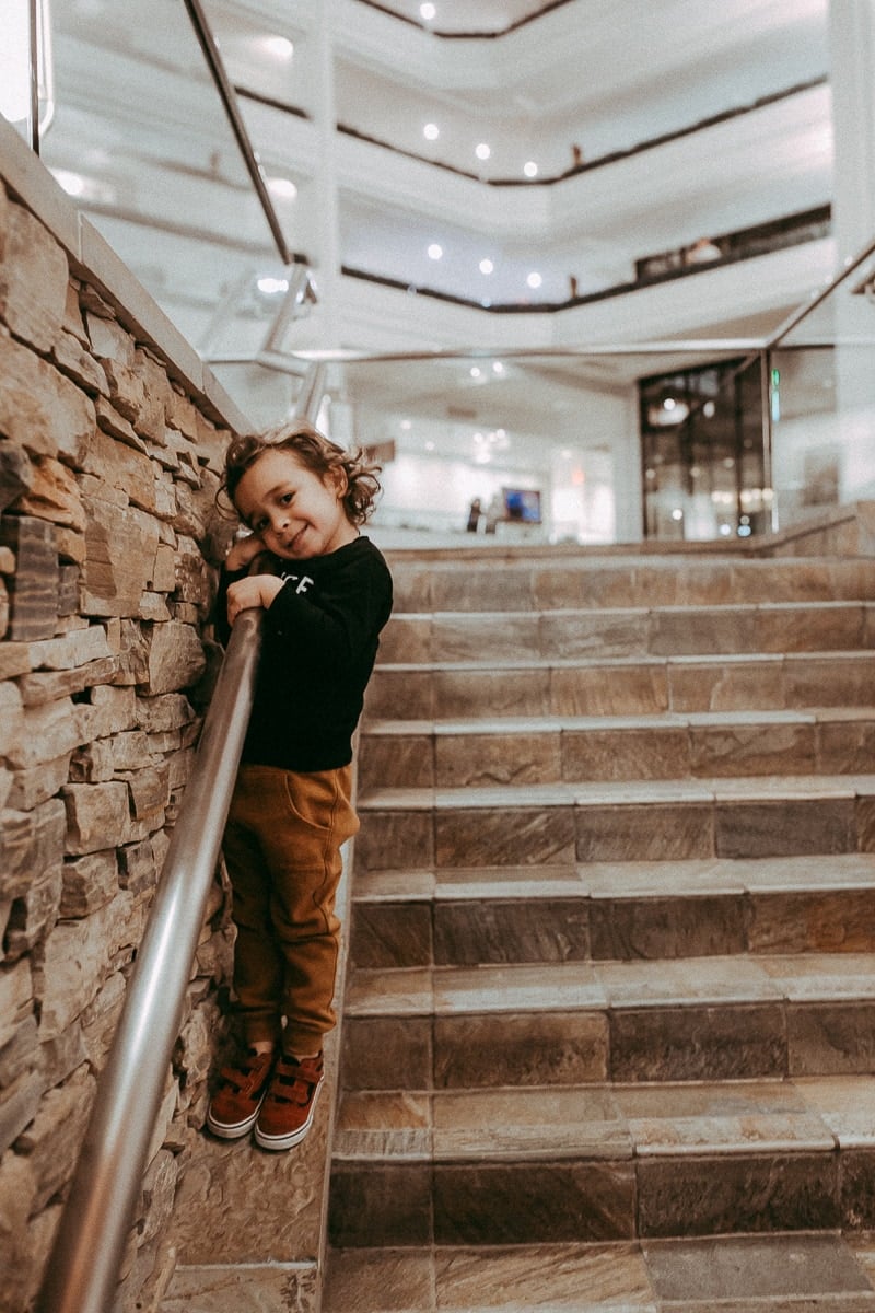 toddler posing on stairs