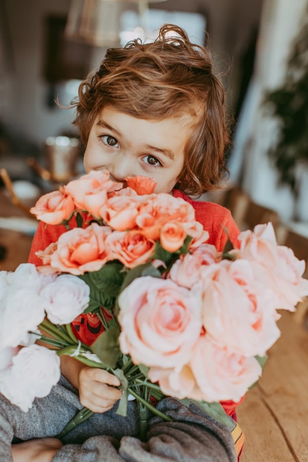 toddler with flowers