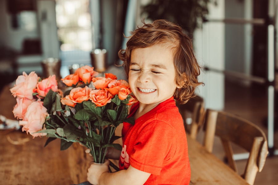 child holding flowers