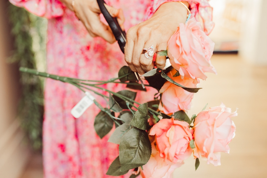 woman cutting roses