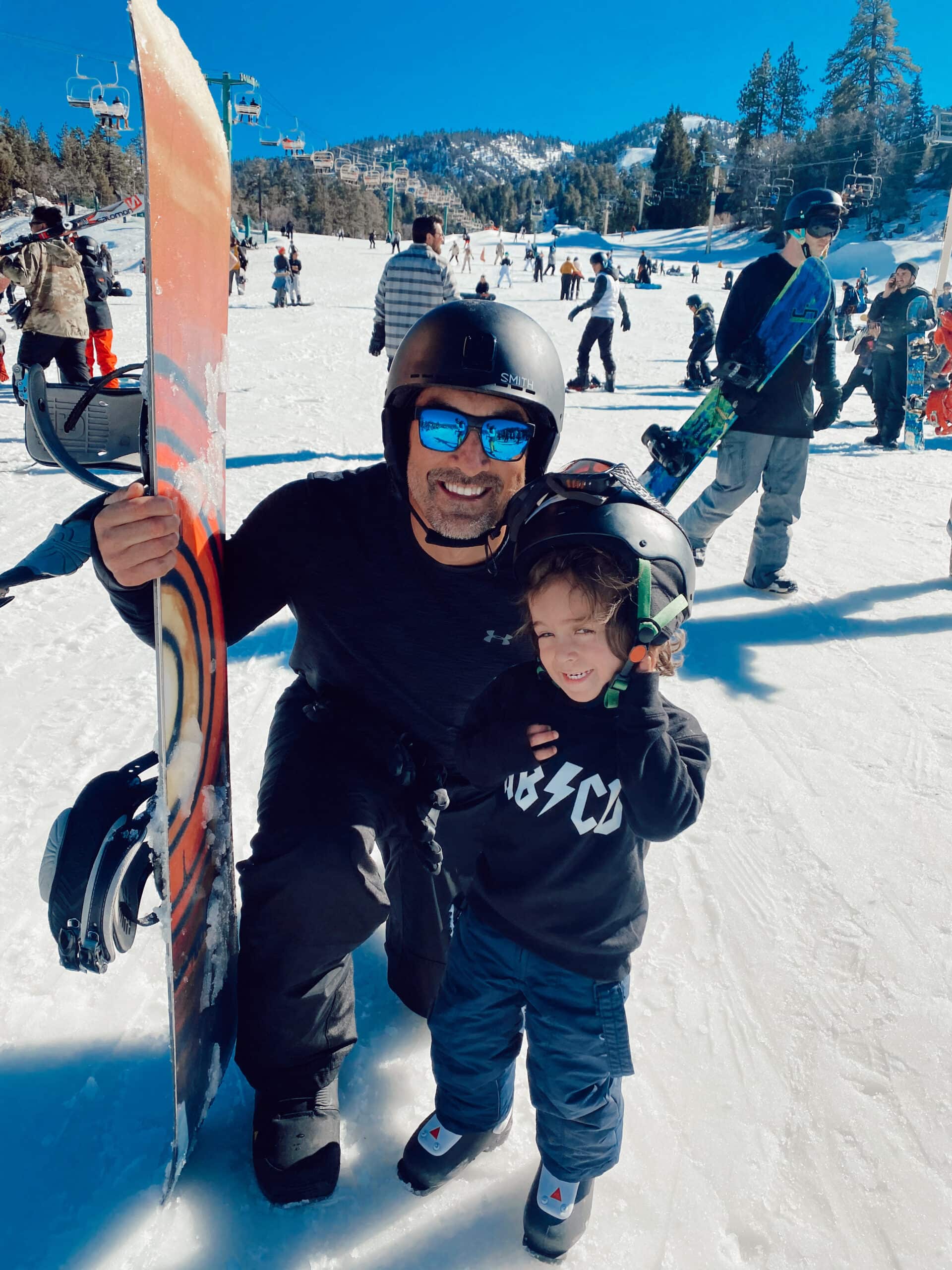 father and son going snowboarding