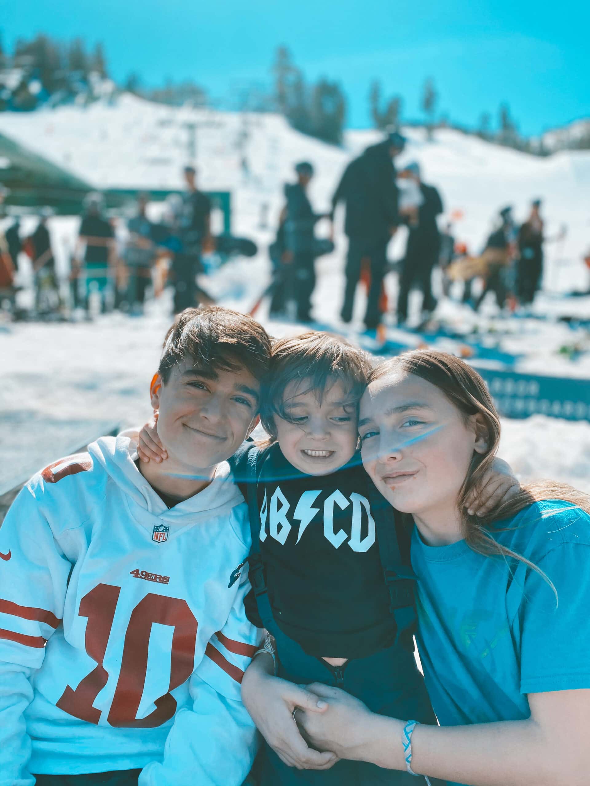 kids hugging at ski resort