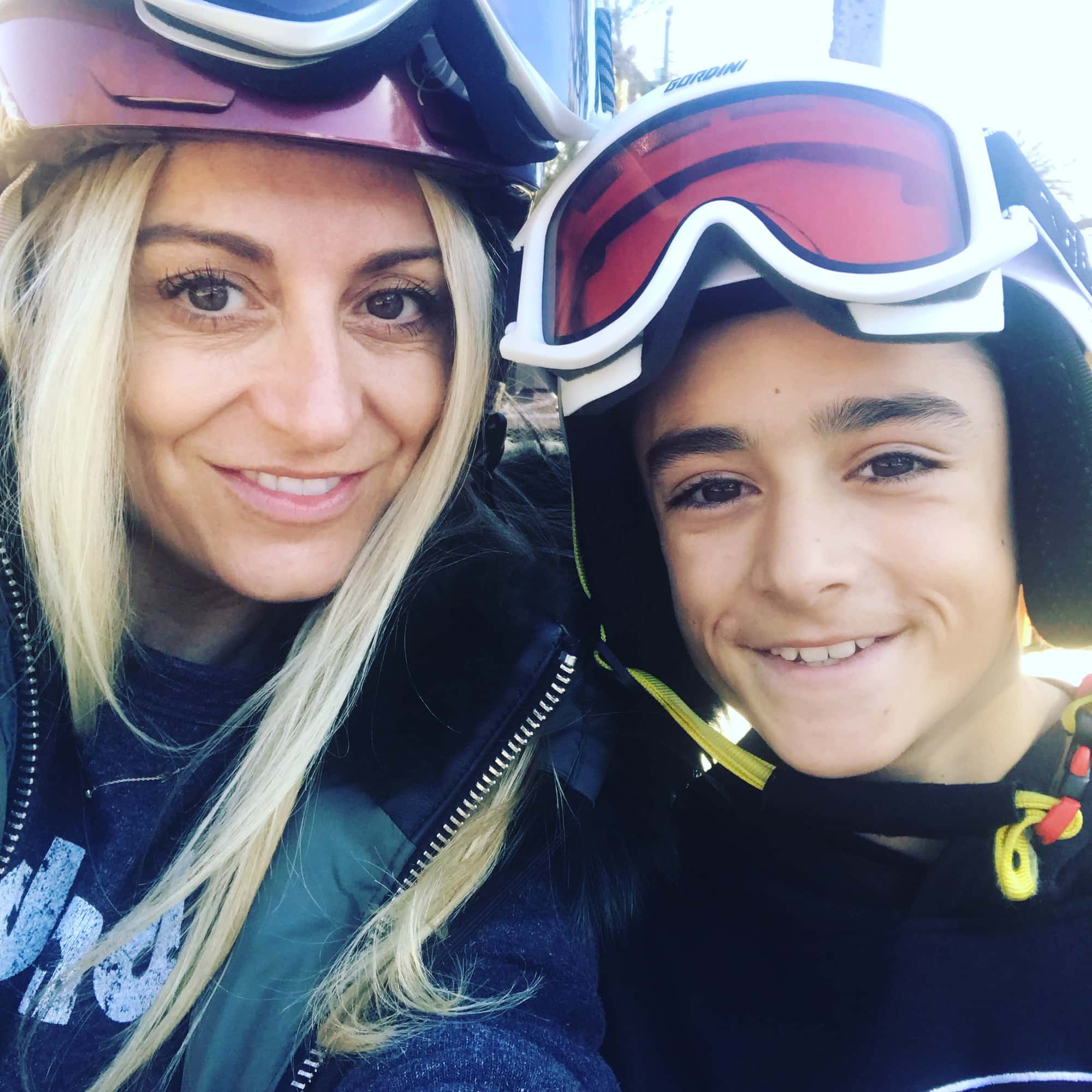 mom and son skiing