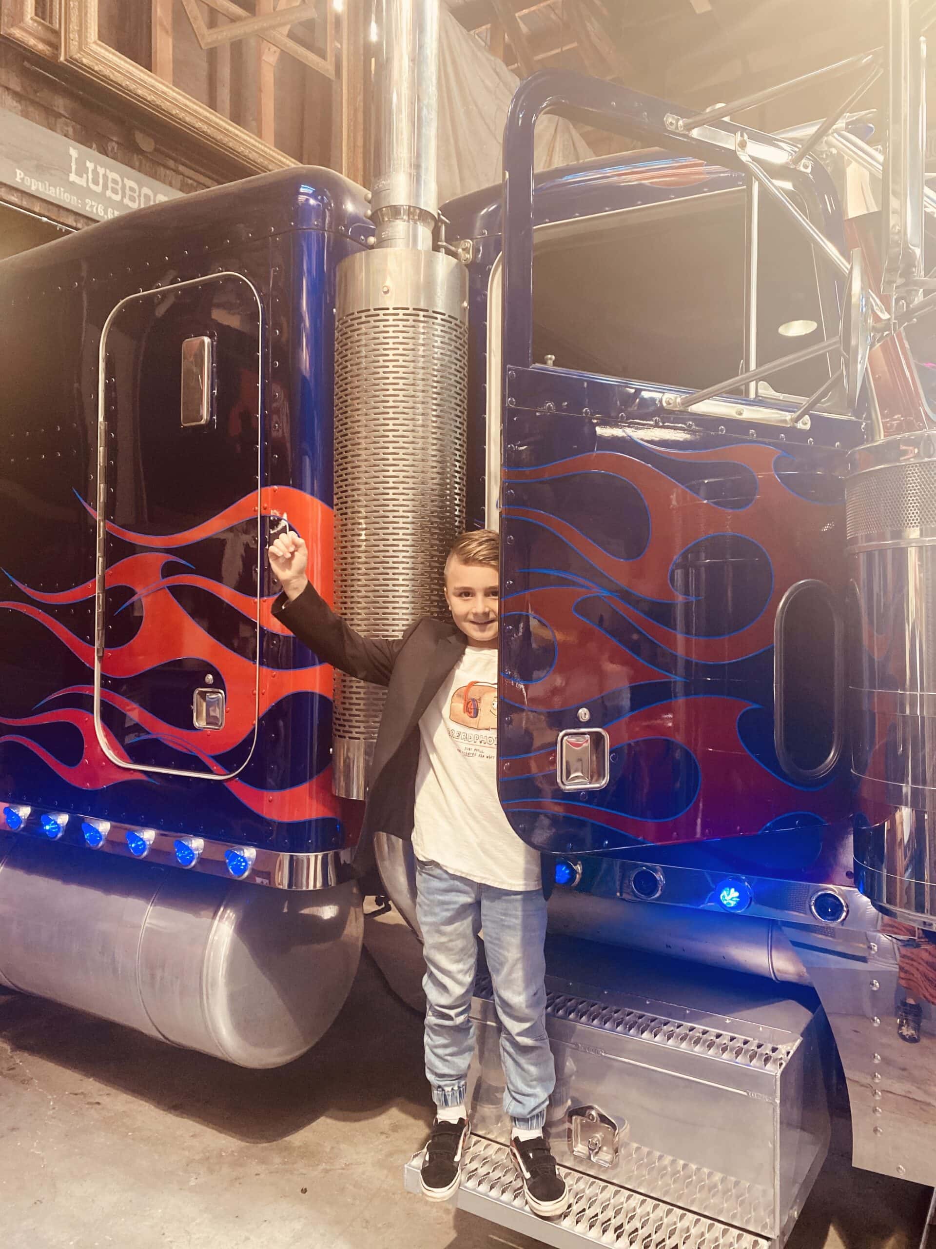 boy in transformers semi truck