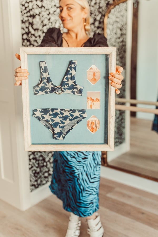 woman holding bikini keepsake