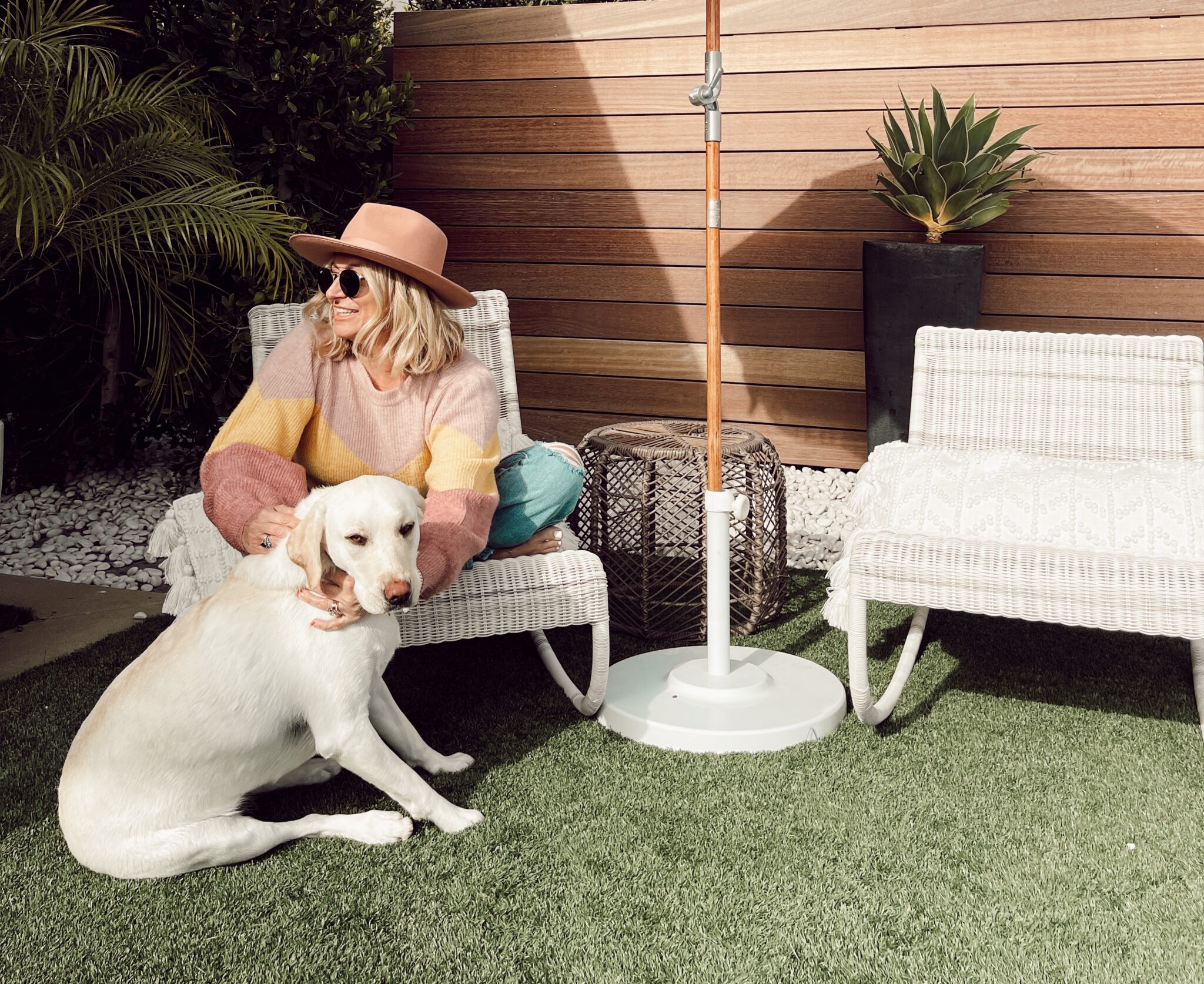 woman sitting outdoors with her dog