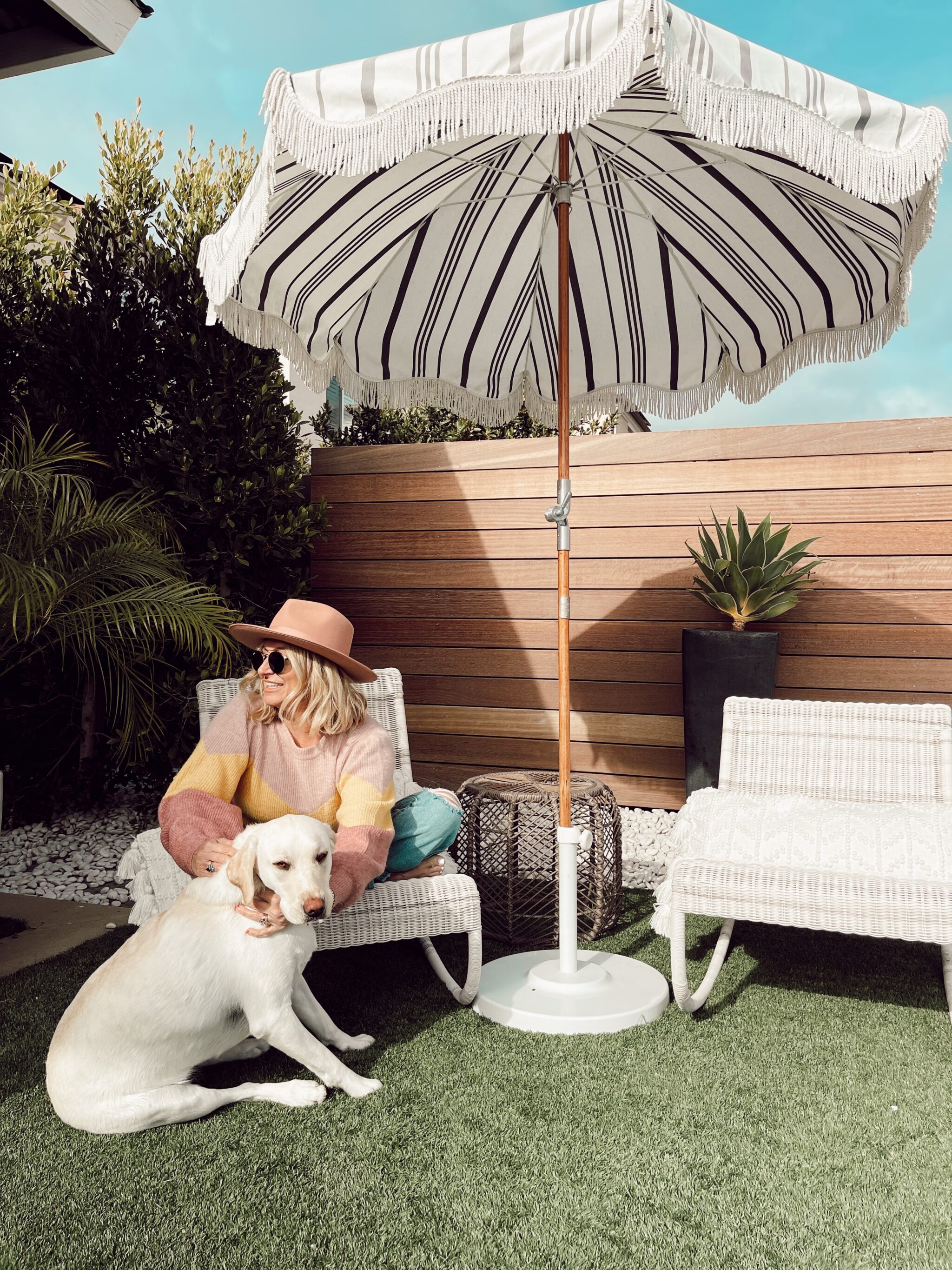 woman sitting outdoors with her dog