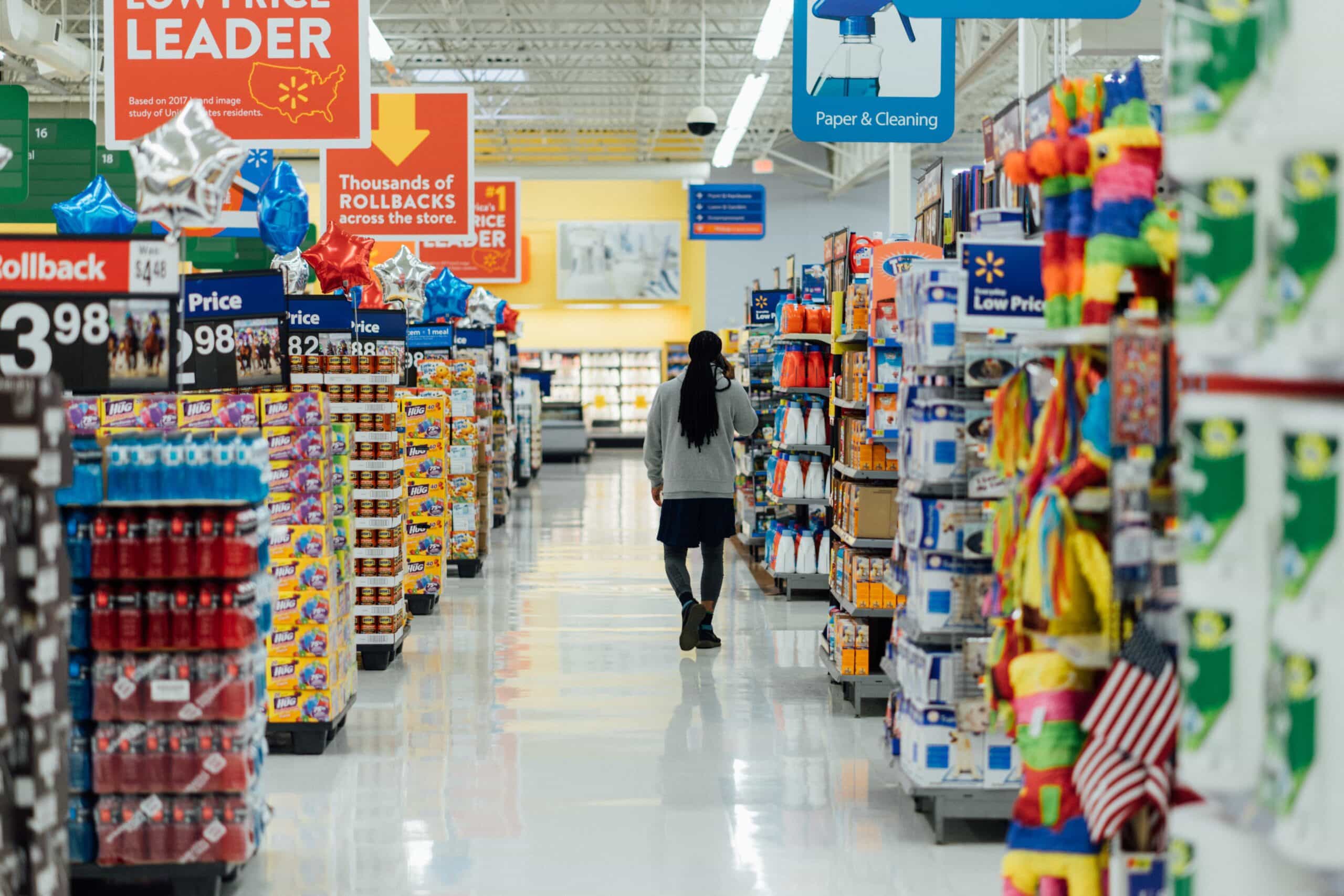 person walking through grocery store