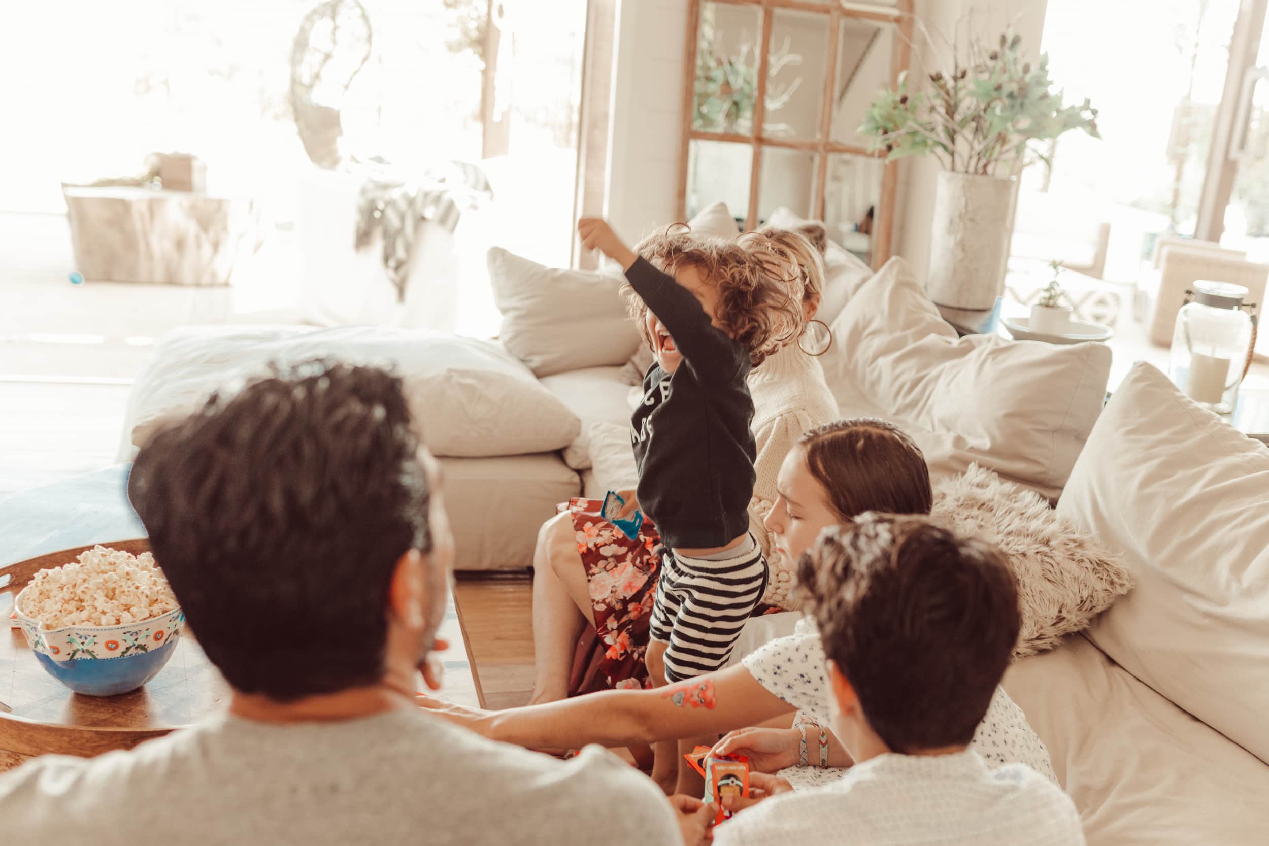 kid jumping on sofa