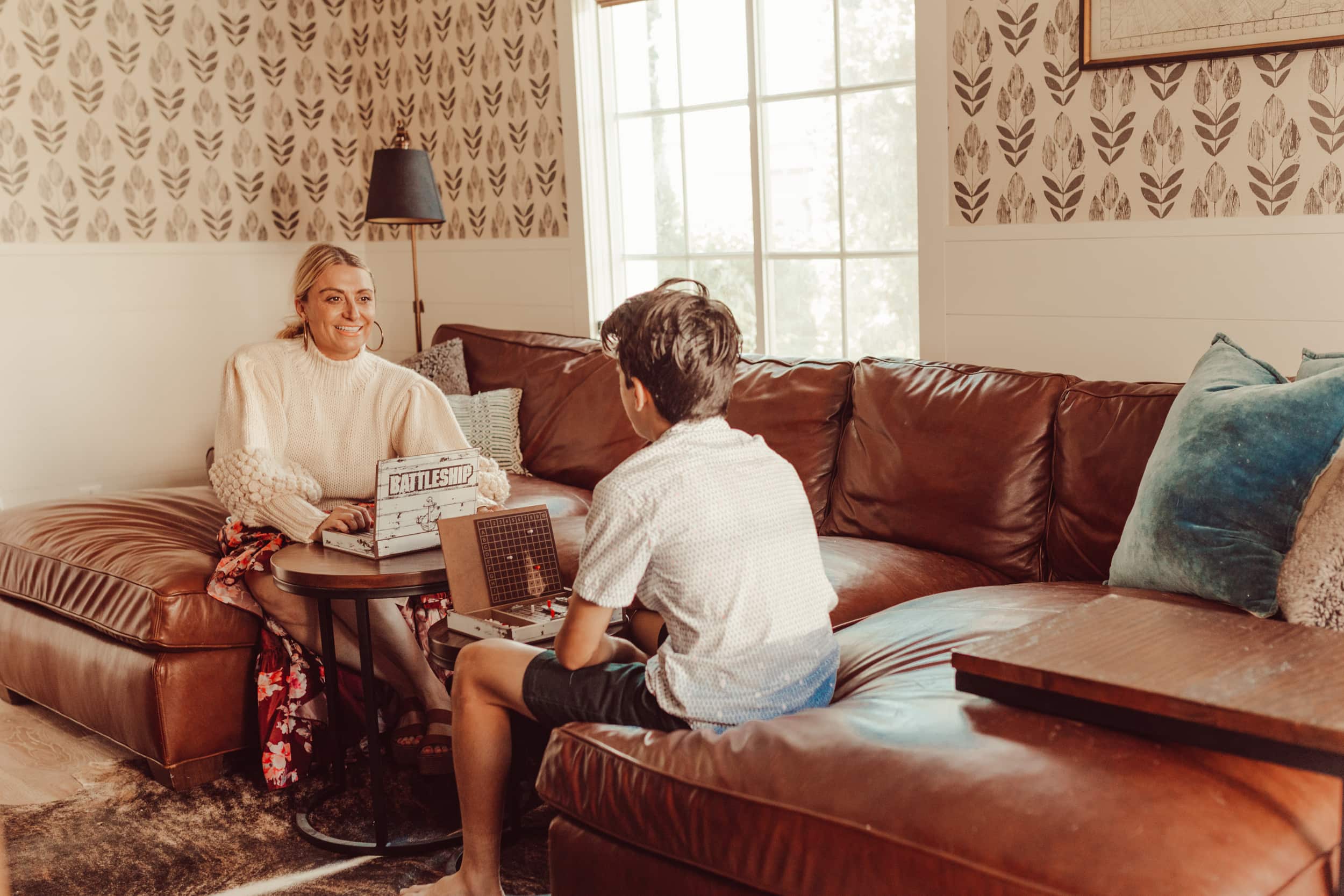 mom and son playing battleship