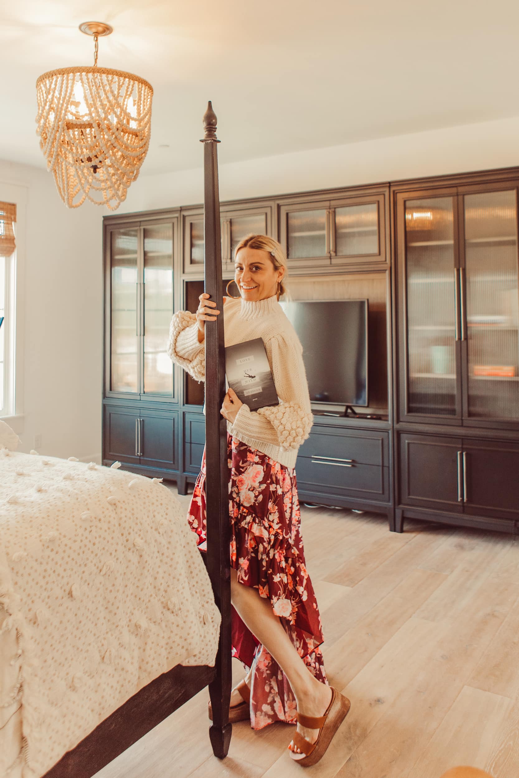 woman standing by bed