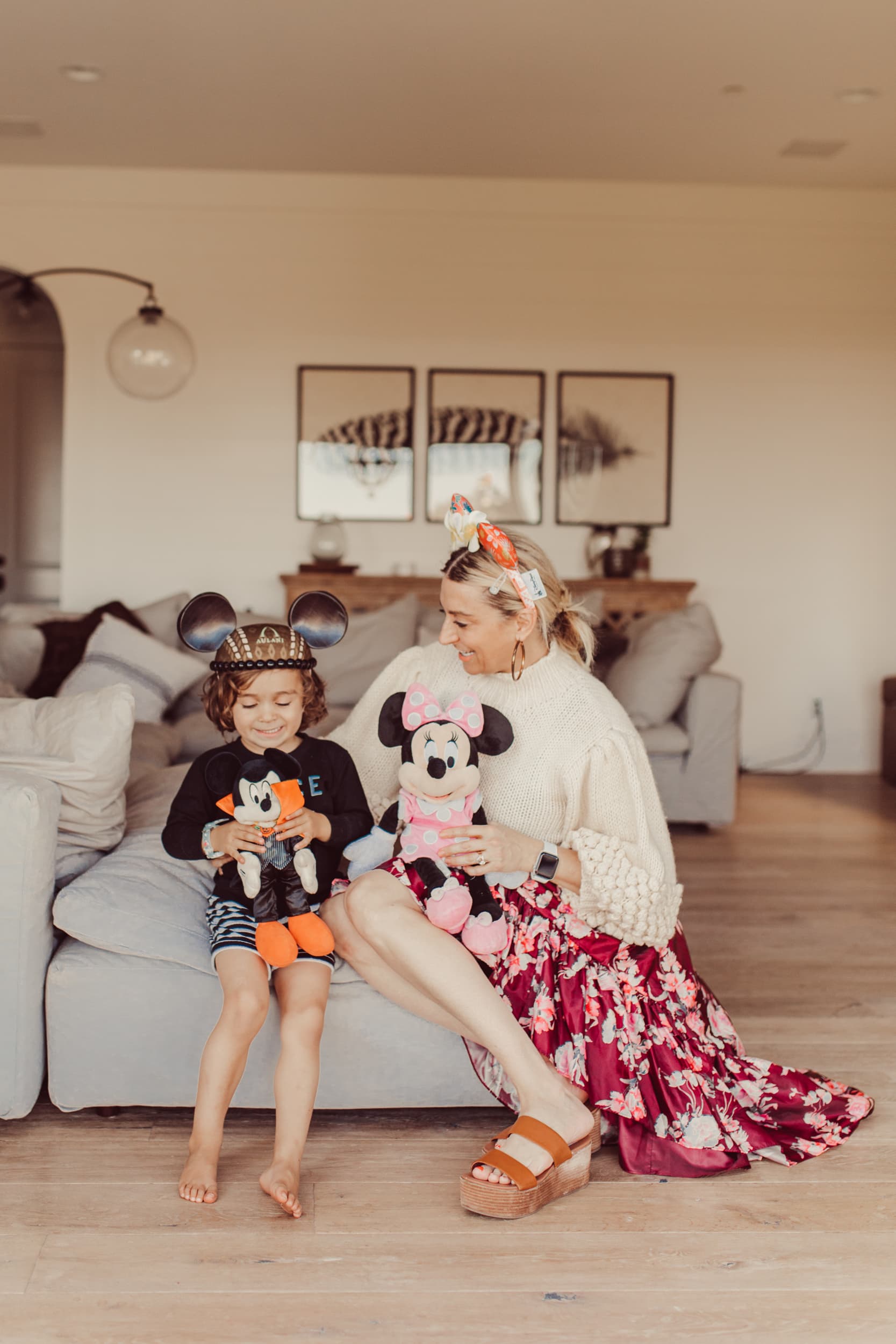 mother and son playing with mickey mouse