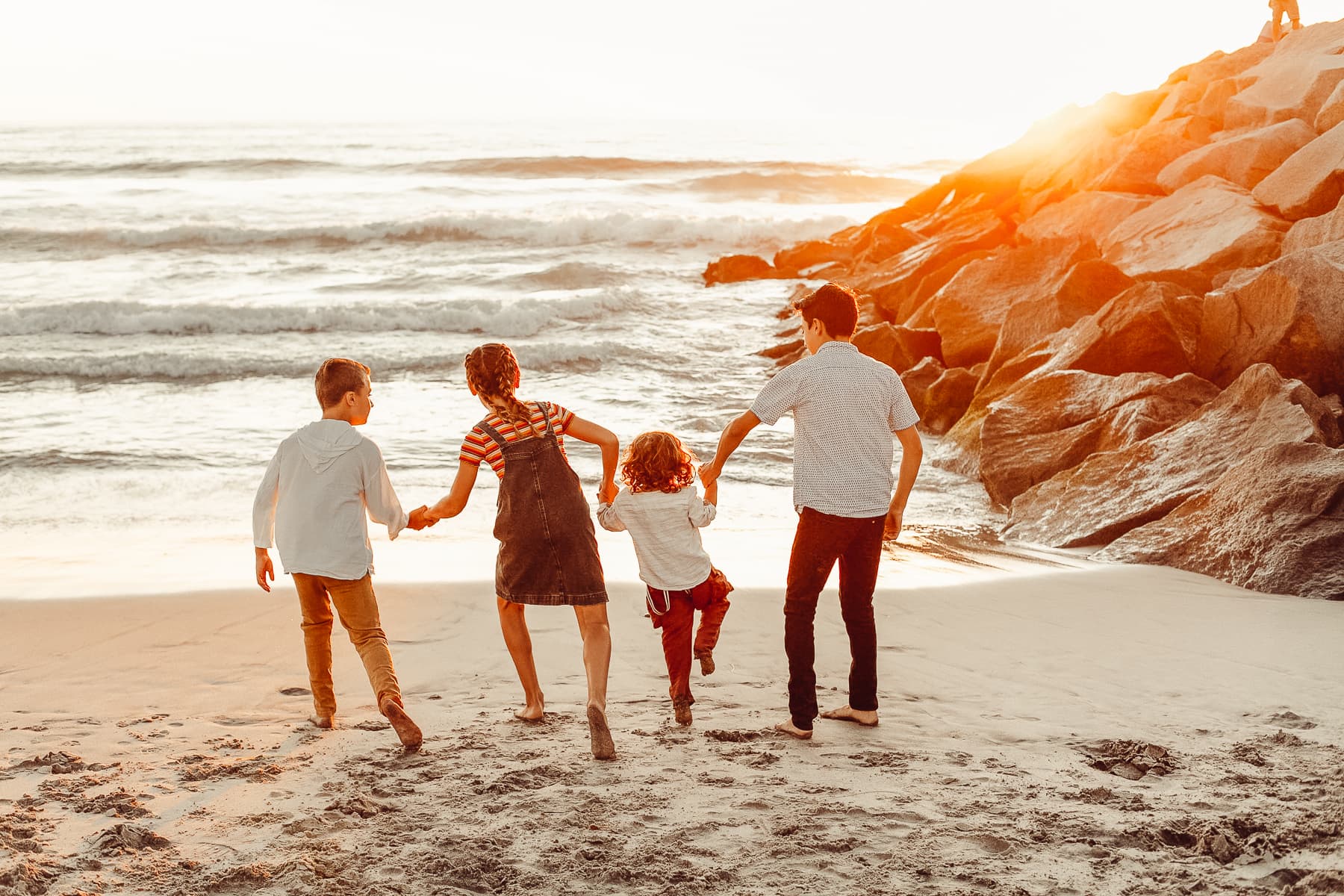 kids on the beach at sunset