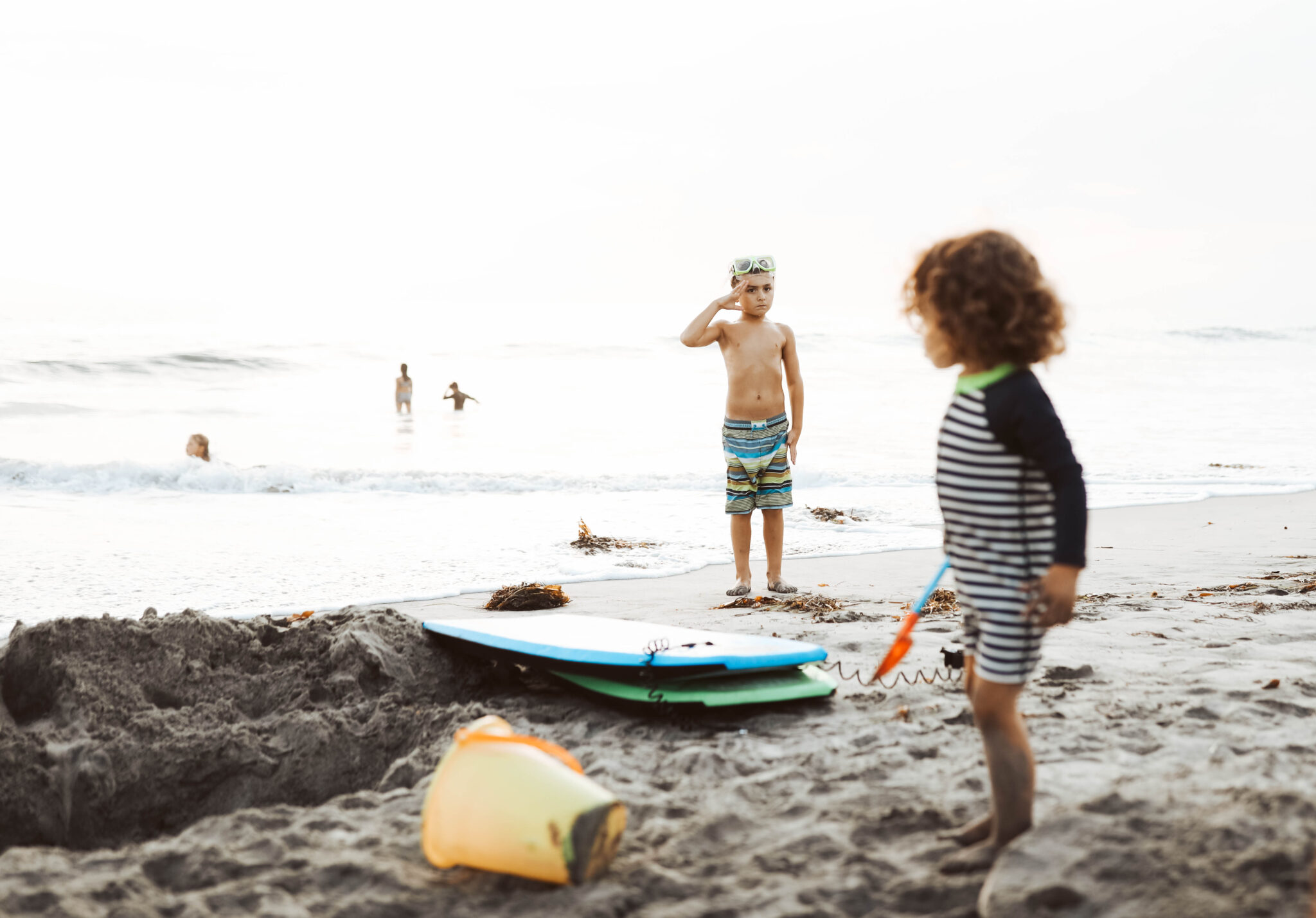 boys playing on the beach