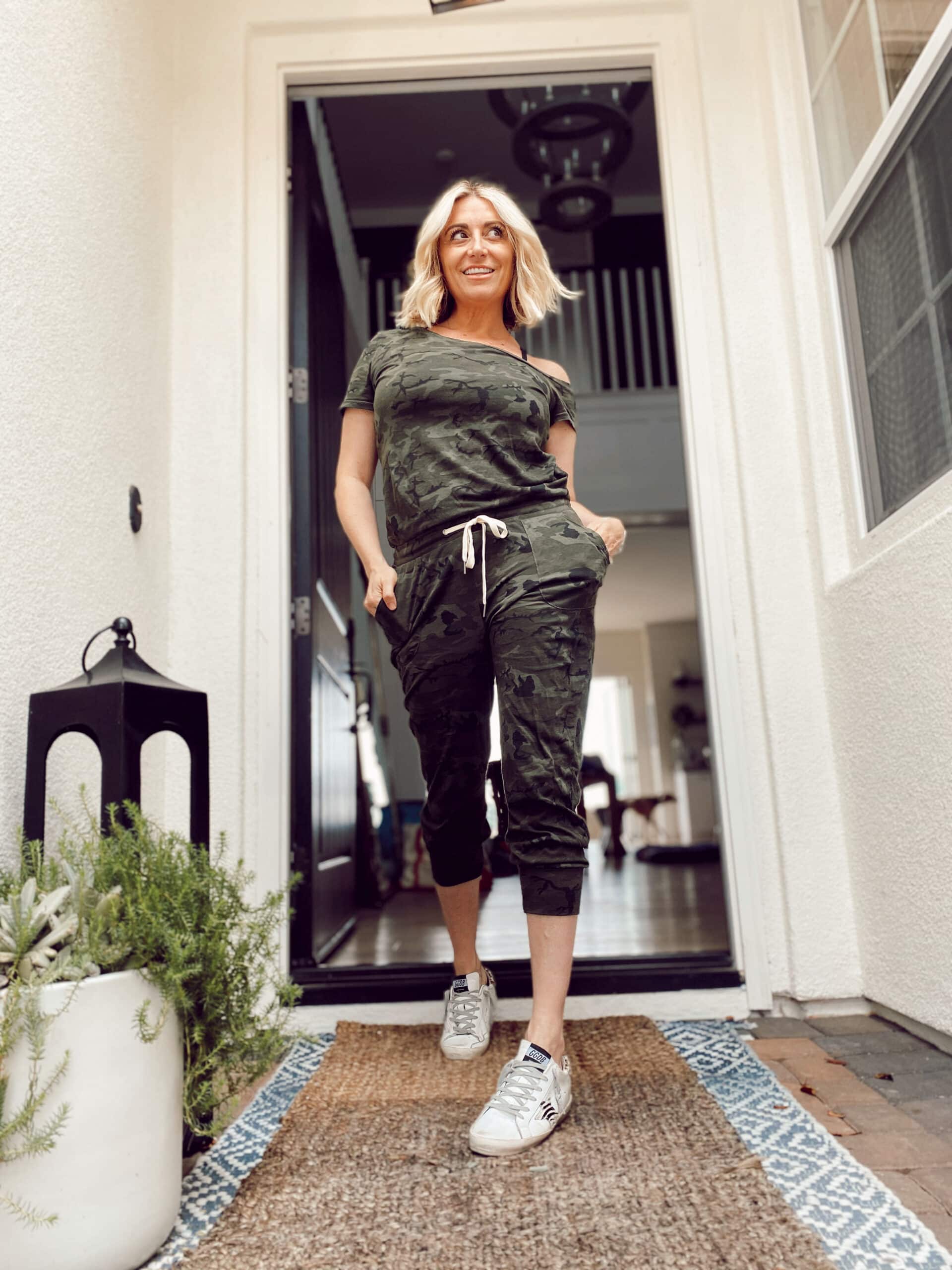 woman walking through door