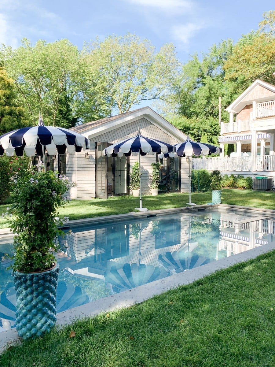 backyard pool with umbrellas