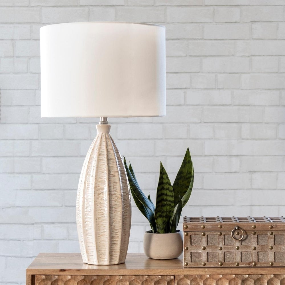 white lamp with plant