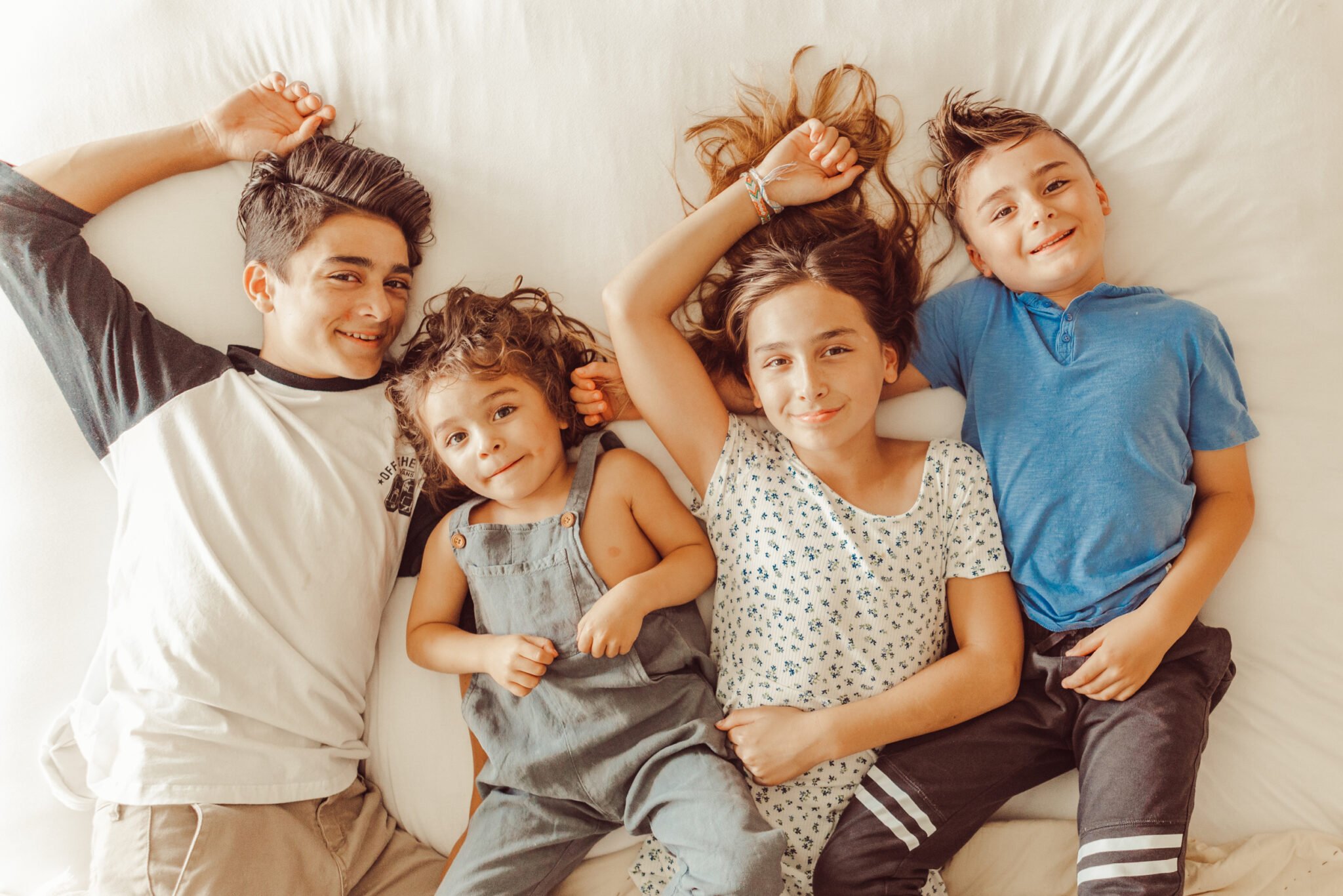 kids hanging out on bed