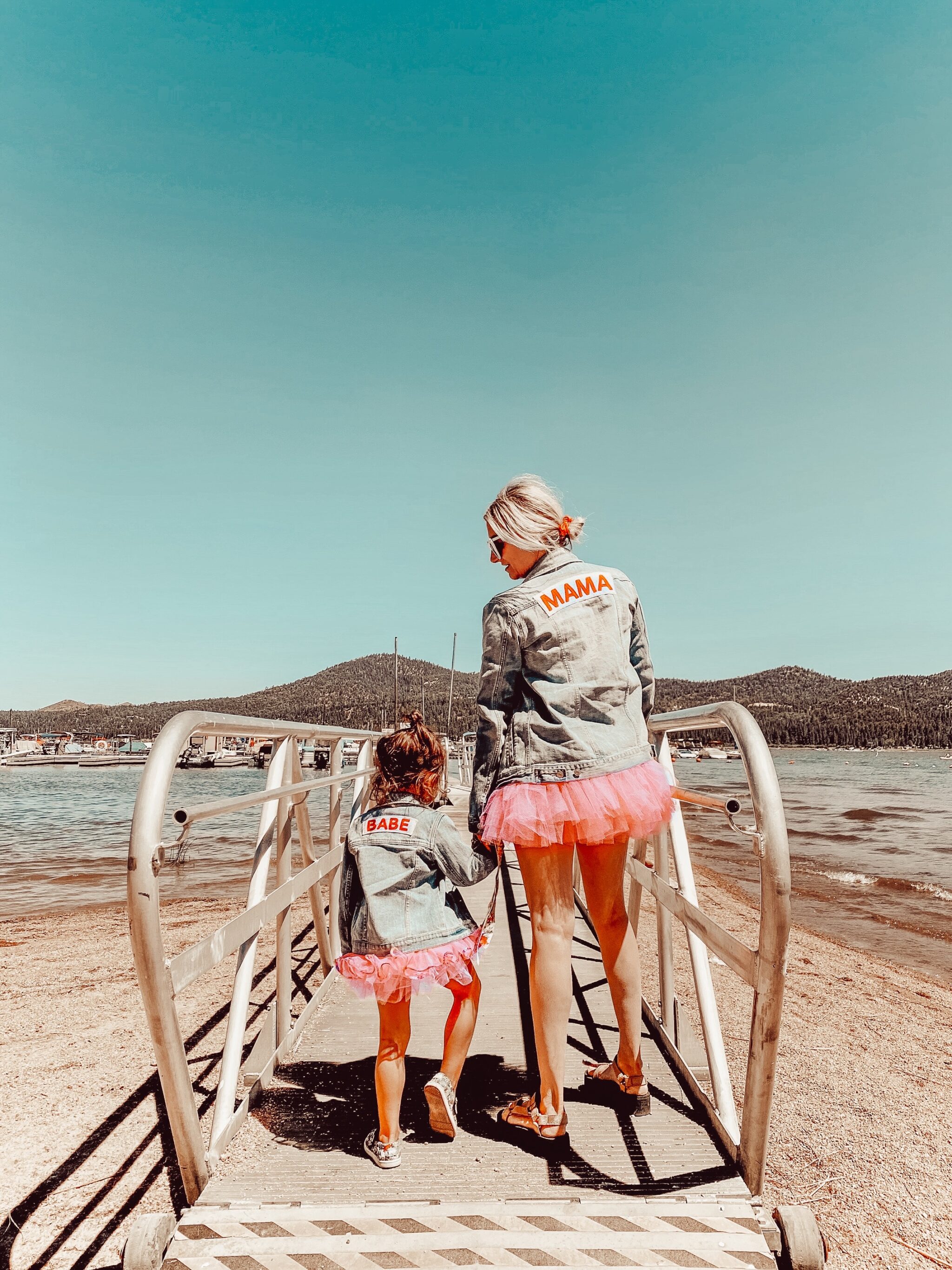 mom and child walking on beach