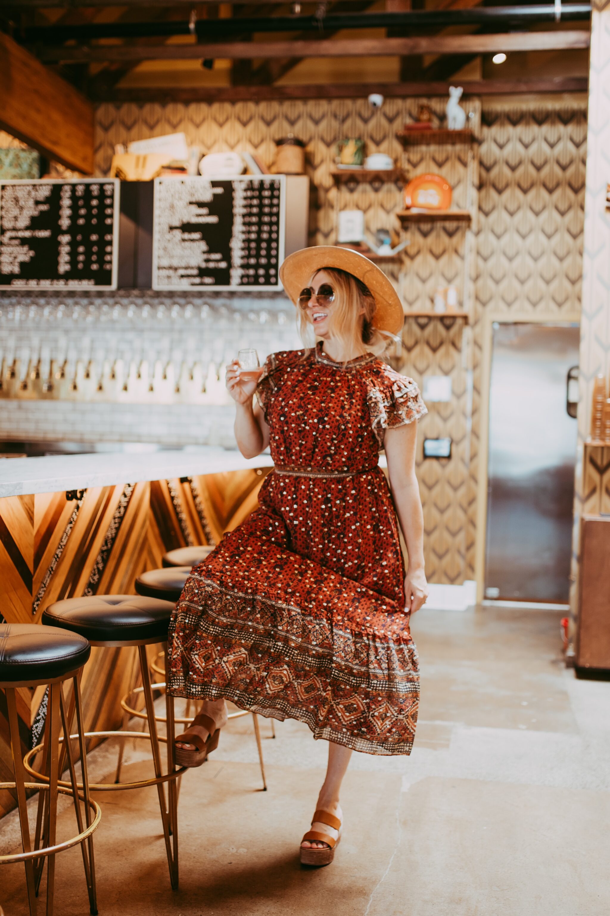 woman having cocktail in bar