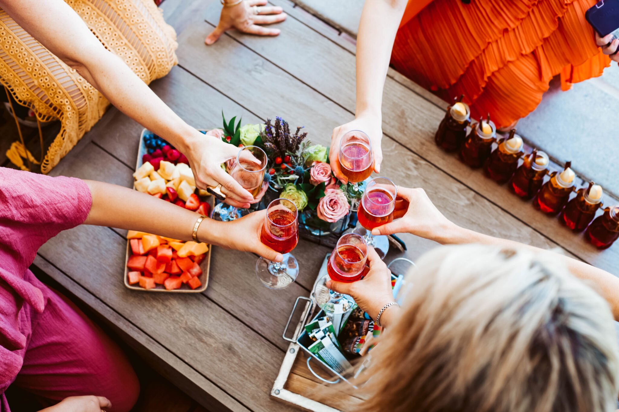 women toasting with drinks