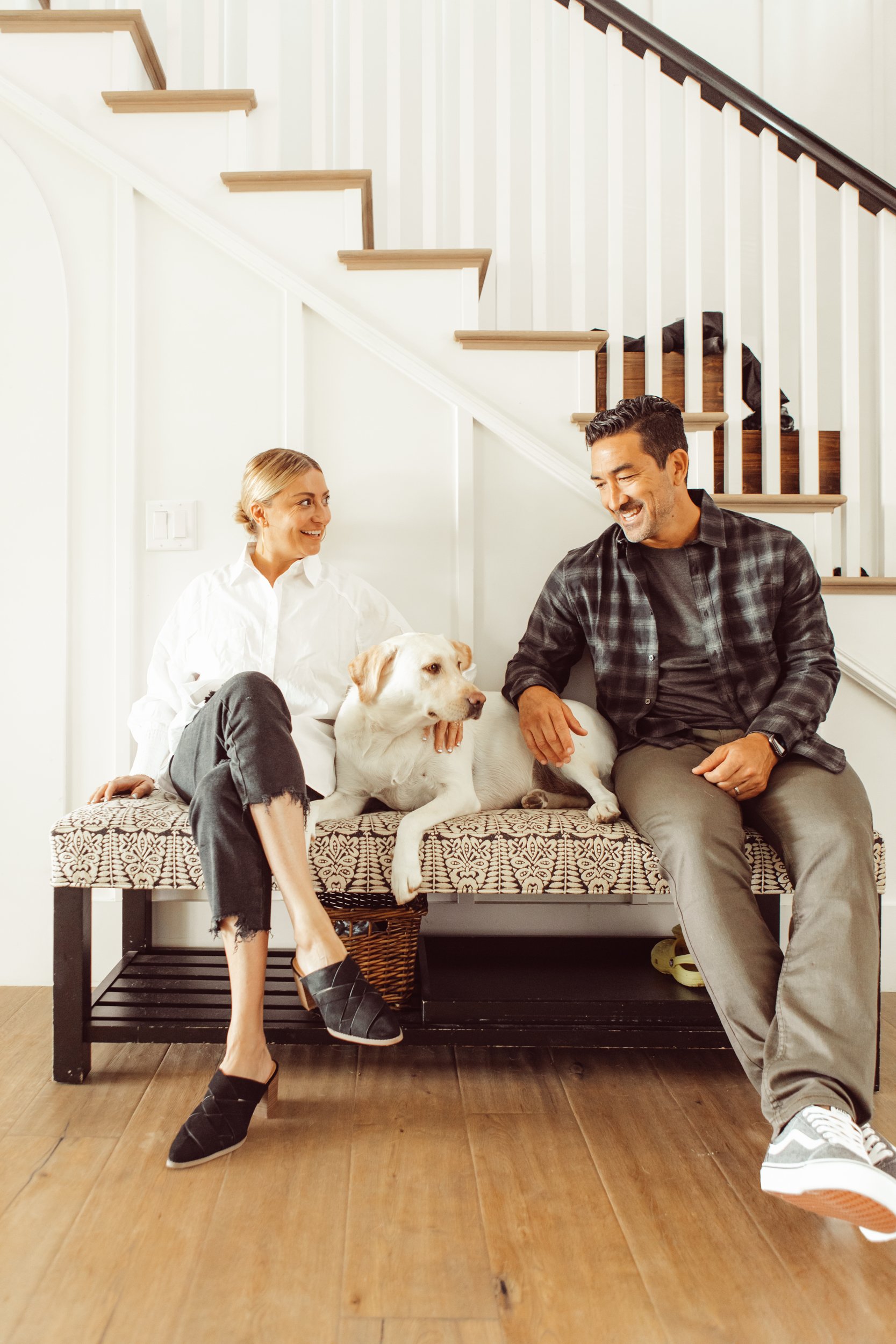 couple sitting with their dog