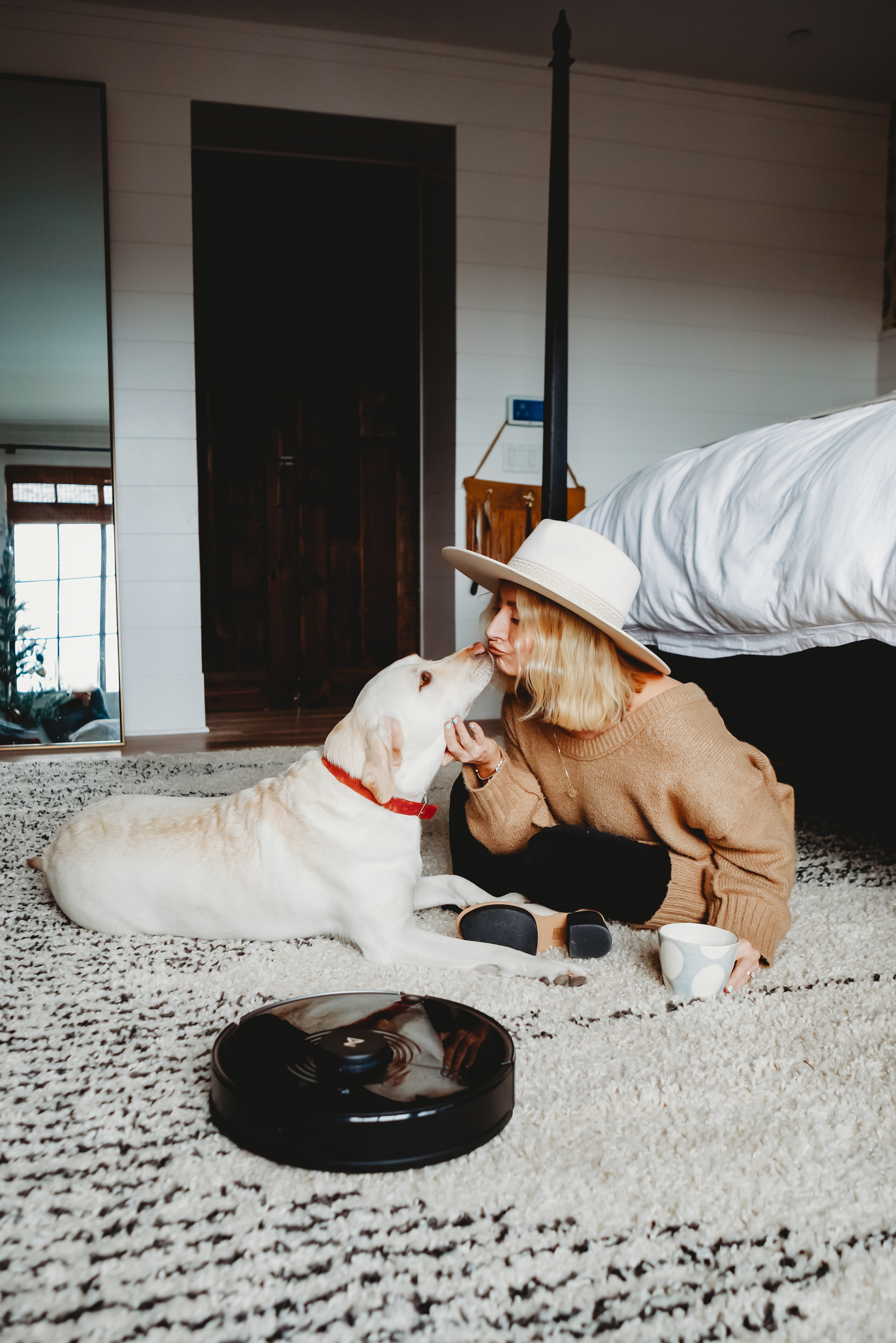 woman and her dog on the carpet