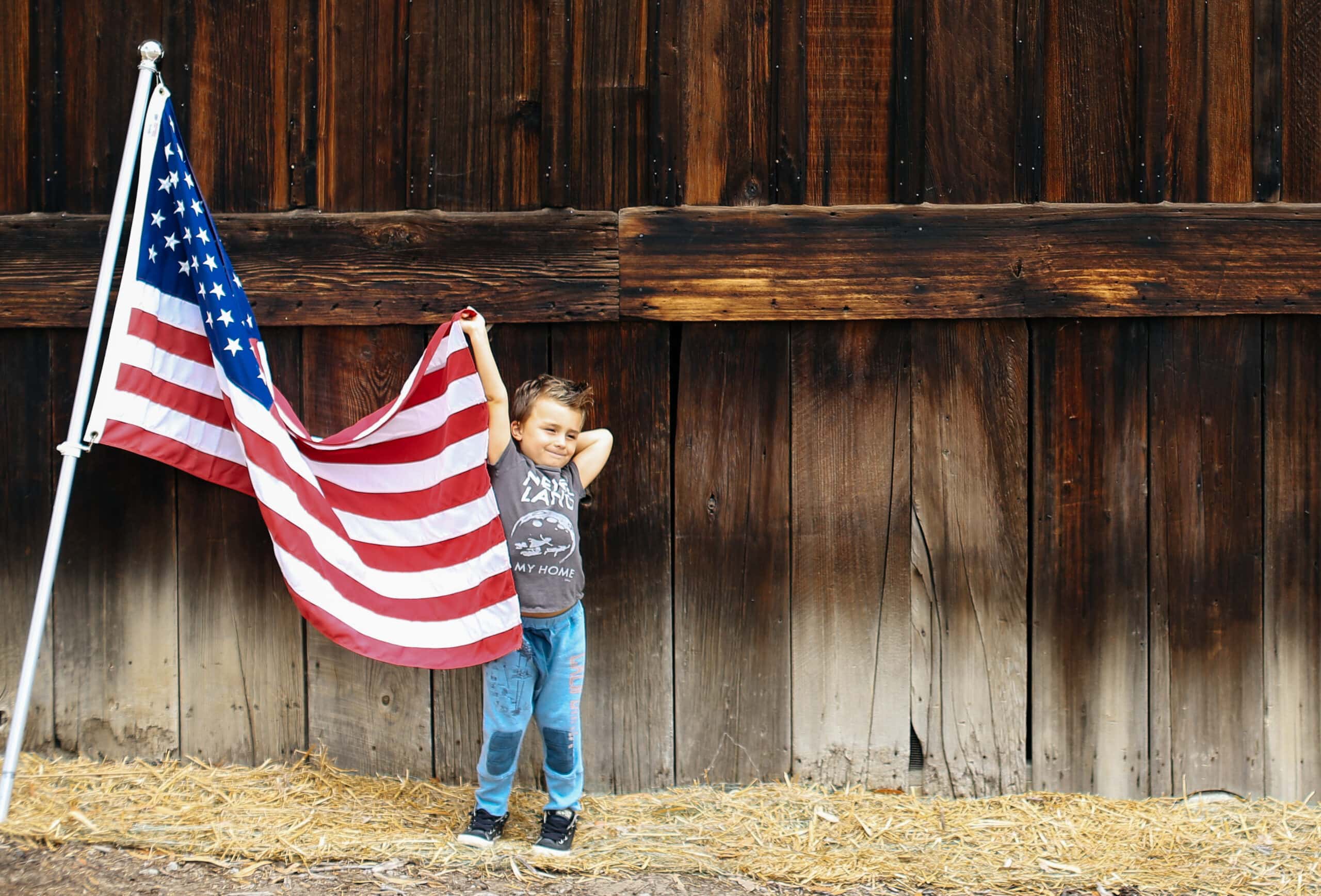 boy holding the American flag