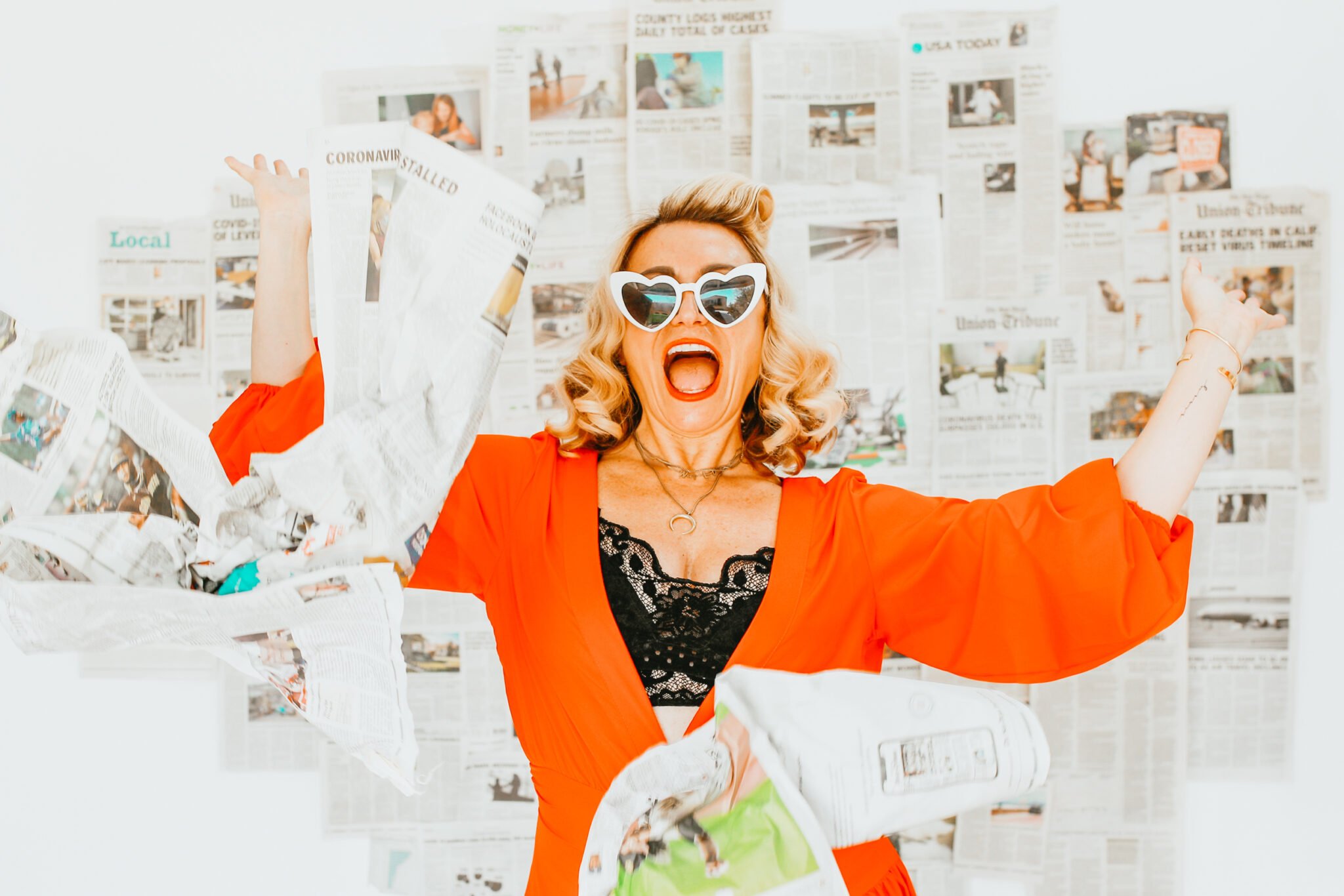 woman throwing newspaper