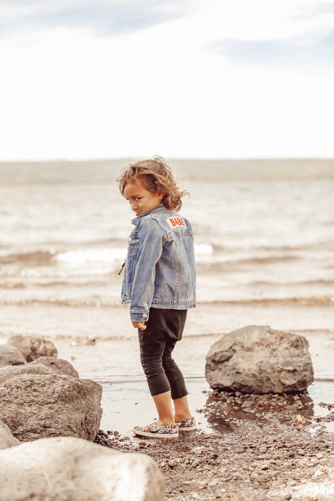 boy standing on the shore