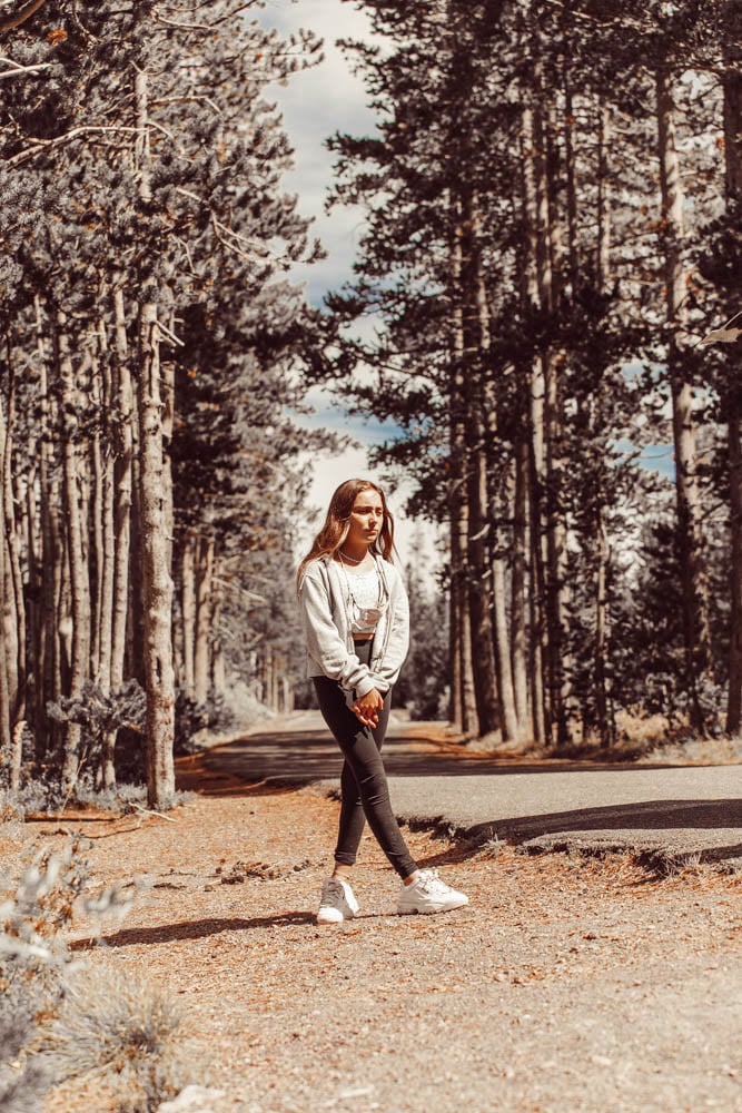 girl walking through the woods