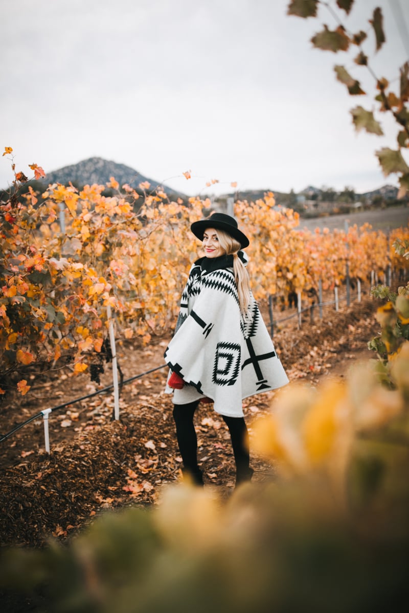 woman in fall leaves