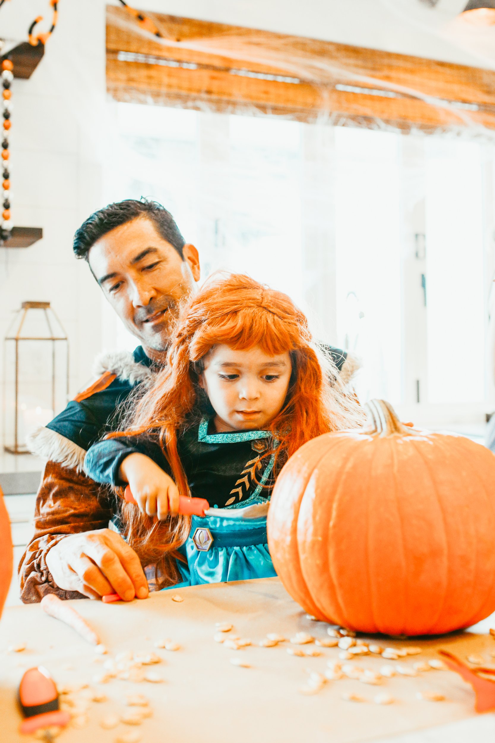 dad and son carving pumpkin